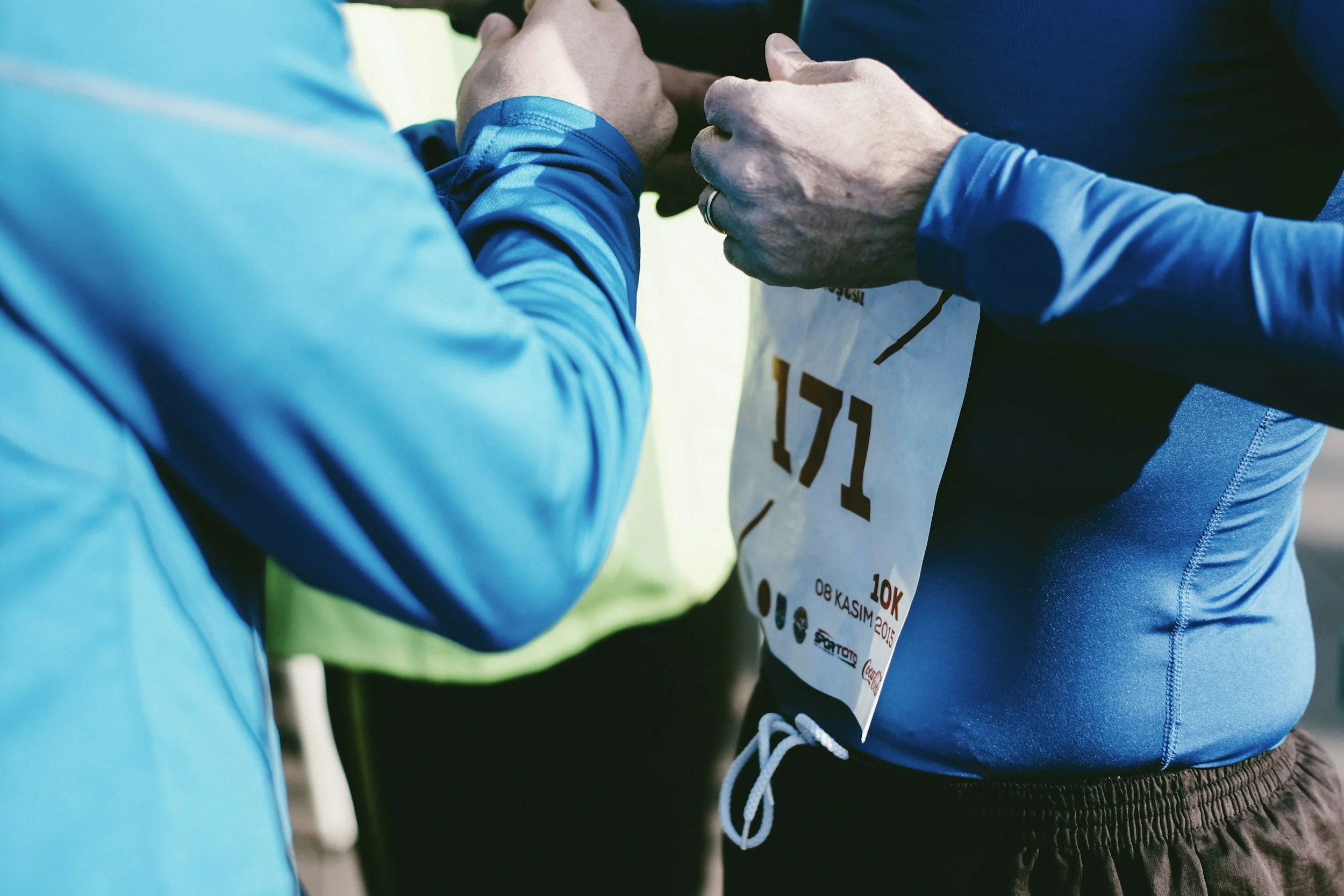 Coach and athlete fist bump, reflecting collaborative SEO strategy services