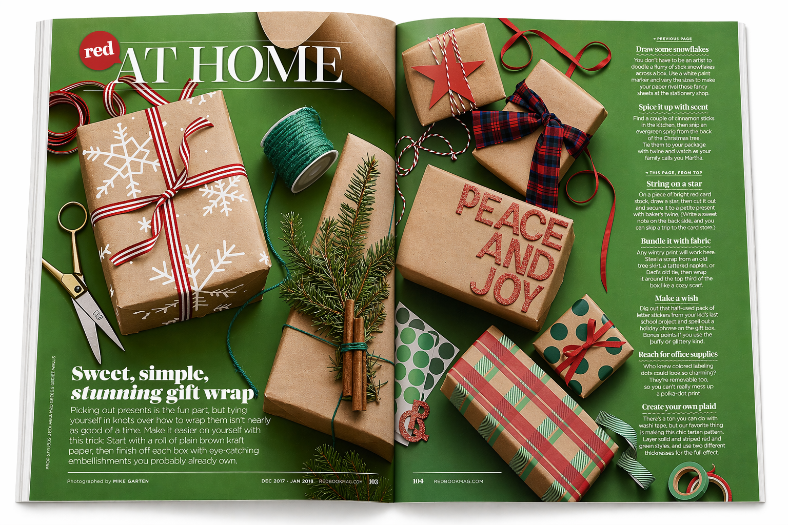 Open magazine spread with Christmas gift wrapping supplies, including wrapped presents, ribbons, scissors, a small pine branch, and crafting materials on a green background.