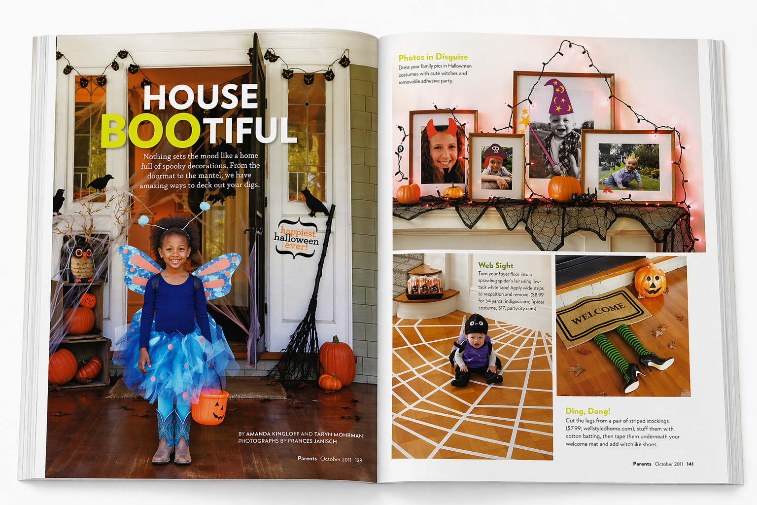 Open magazine showing Halloween decorations including a girl in a fairy costume on the left page, and on the right page, Halloween-themed photo displays, a spooky spider web on the floor, and a small pumpkin decoration with a welcome mat.