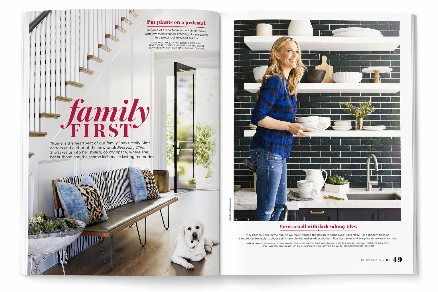 Magazine spread featuring home interior design with the title 'family FIRST'. Left page shows a modern sitting area with a bench, pillows, and a dog lying on the floor. Right page shows a woman in a kitchen holding dishes in front of dark subway tile