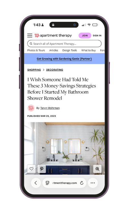 A smartphone displaying an article webpage from apartment therapy about bathroom remodel tips, with a photo of a modern bathroom with dual sinks, mirrors, and plants.