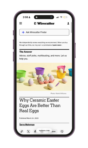 A smartphone displaying an article titled "Why Ceramic Easter Eggs Are Better Than Real Eggs" on the Wirecutter website, with a background of colorful ceramic Easter eggs and egg cups.