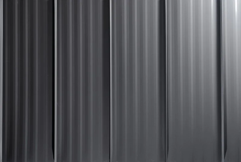 Close-up of a black, .standing seem metal roofing that Revolution Roofing offers