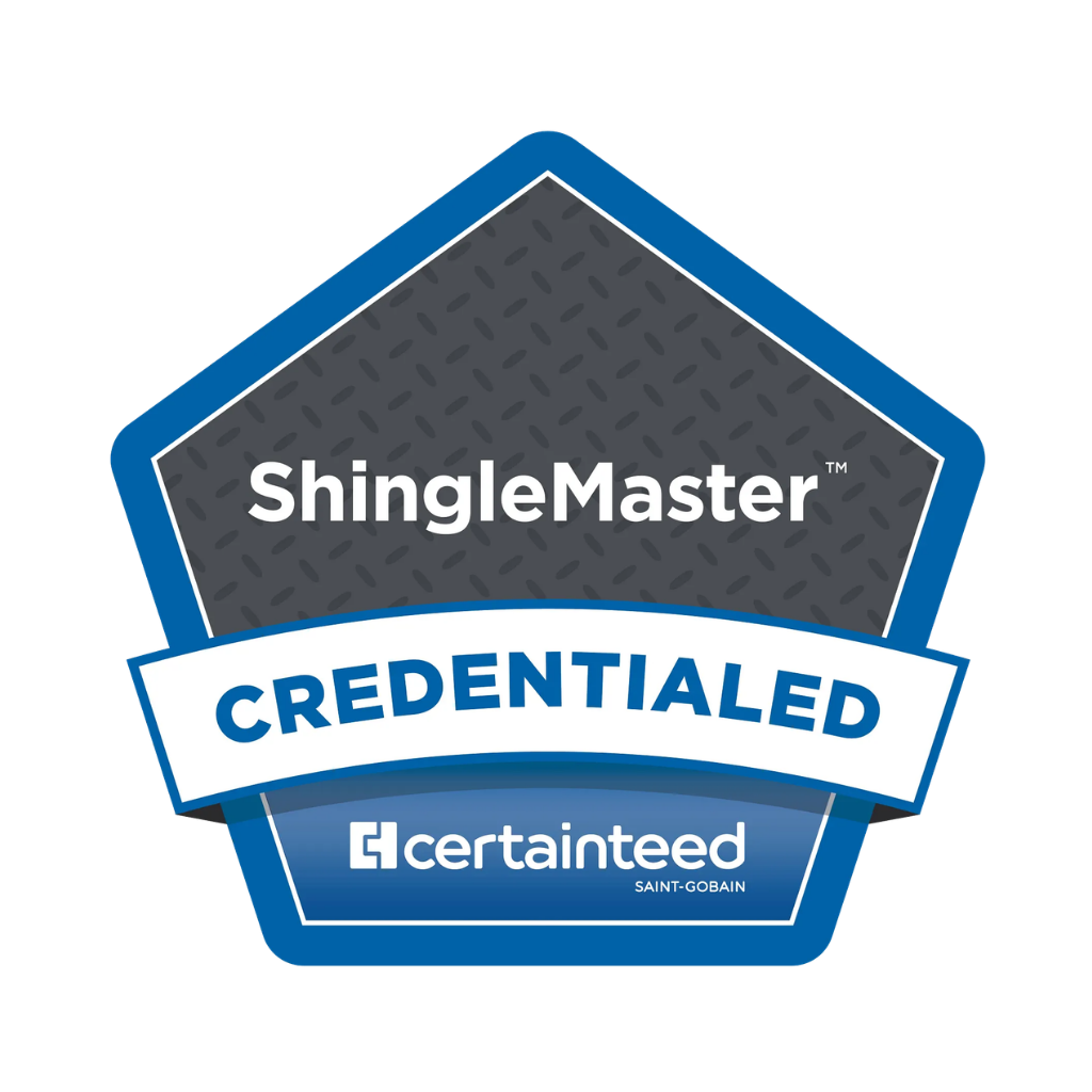 ShingleMaster Credentialed sticker with a blue border, featuring a gray pentagonal shape with a diamond plate pattern, the words "ShingleMaster" in white and "Credentialed" in blue on a white banner, and the Certainty logo at the bottom, along with Saint-Gobain branding.
