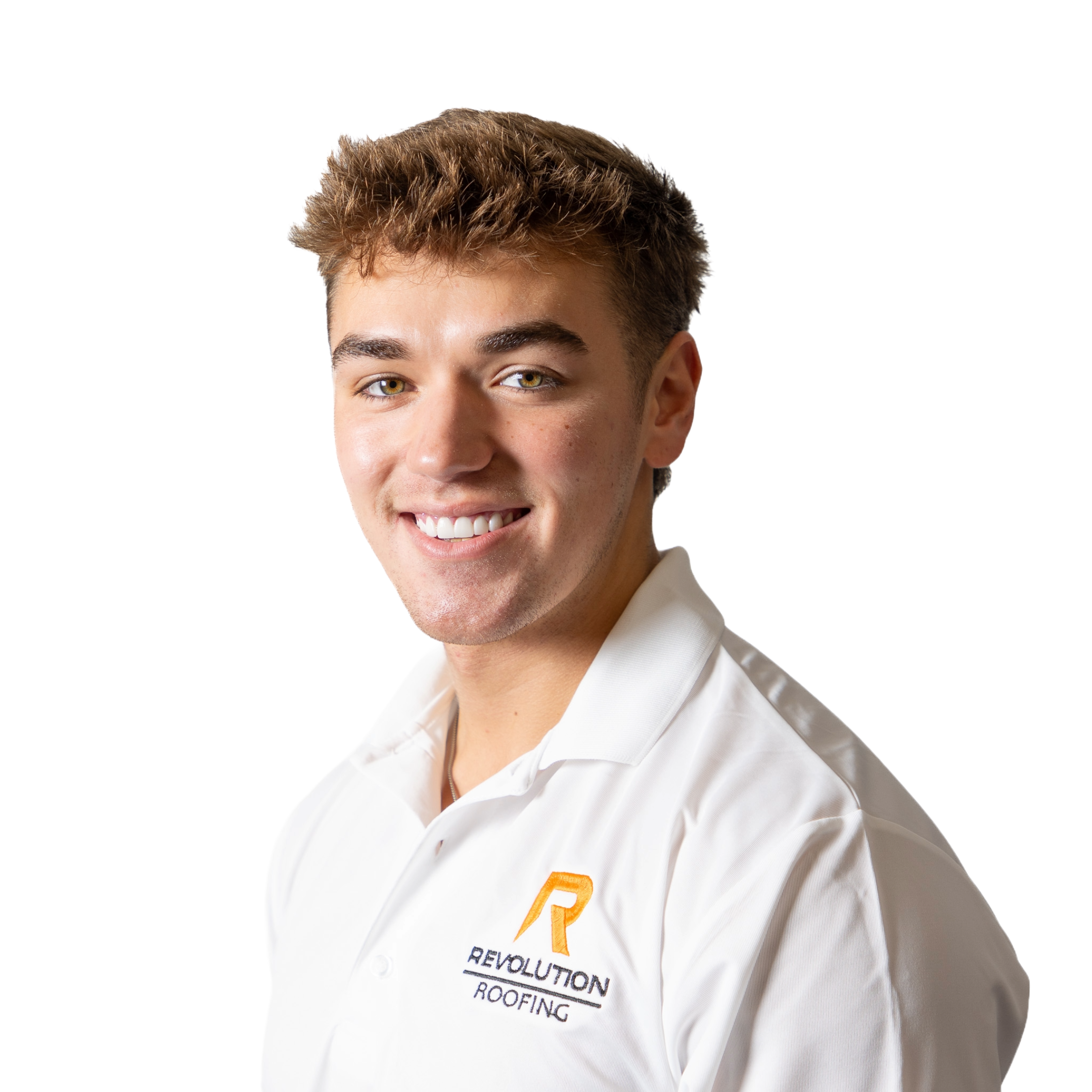 Close-up of a young man with light brown hair, blue eyes, and a friendly smile wearing a white shirt with an orange and black logo on the chest, standing against a white background.