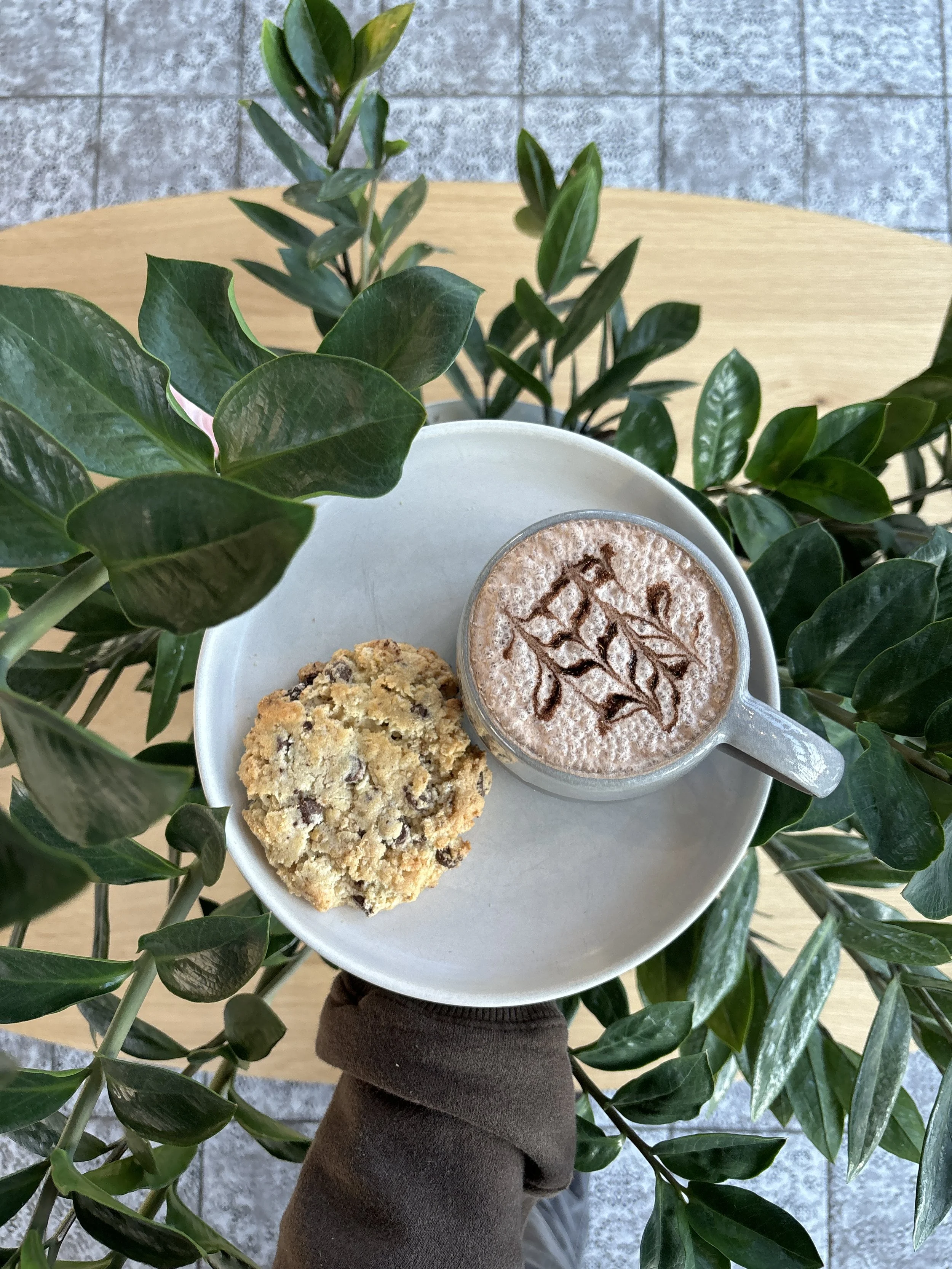 Delicious specialty coffee with a fresh baked cookie