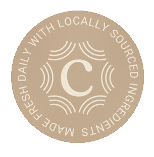 A circular logo with a large letter 'C' in the center, surrounded by wavy lines. The outer ring reads "MADE FRESH DAILY WITH LOCALLY SOURCED INGREDIENTS."
