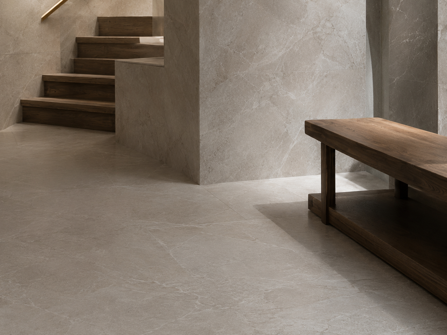 Pale limestone floor and wall cladding in a minimalist entrance hall