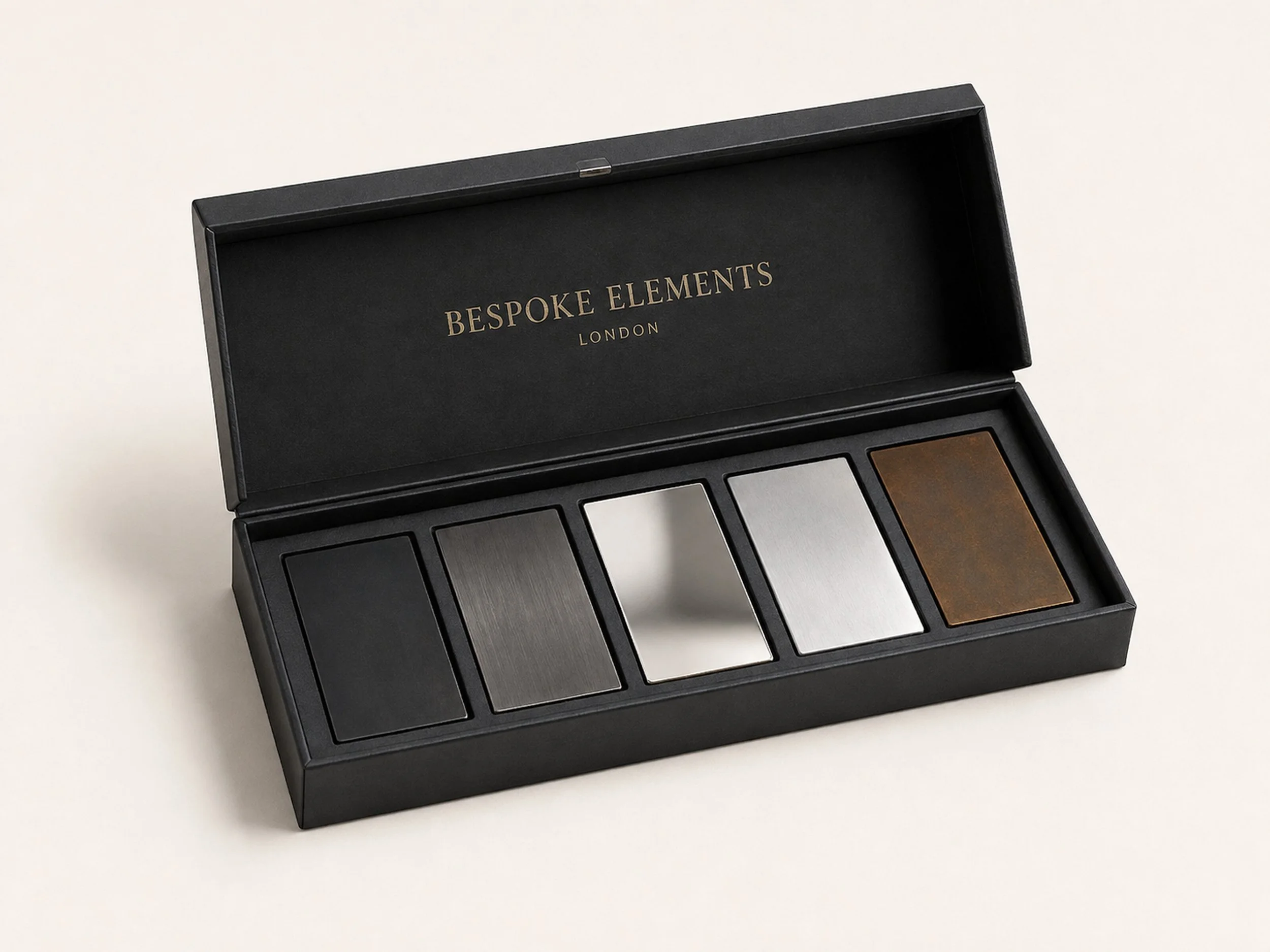 Open Bespokelements presentation case containing five architectural steel finish samples.