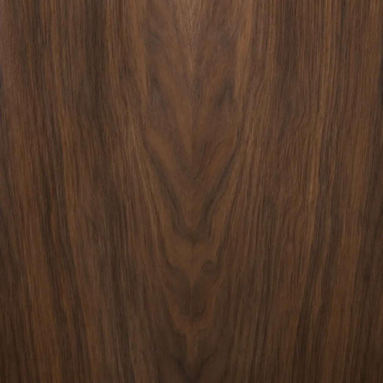 Close-up of a wooden surface with a visible wood grain pattern and warm brown tones.
