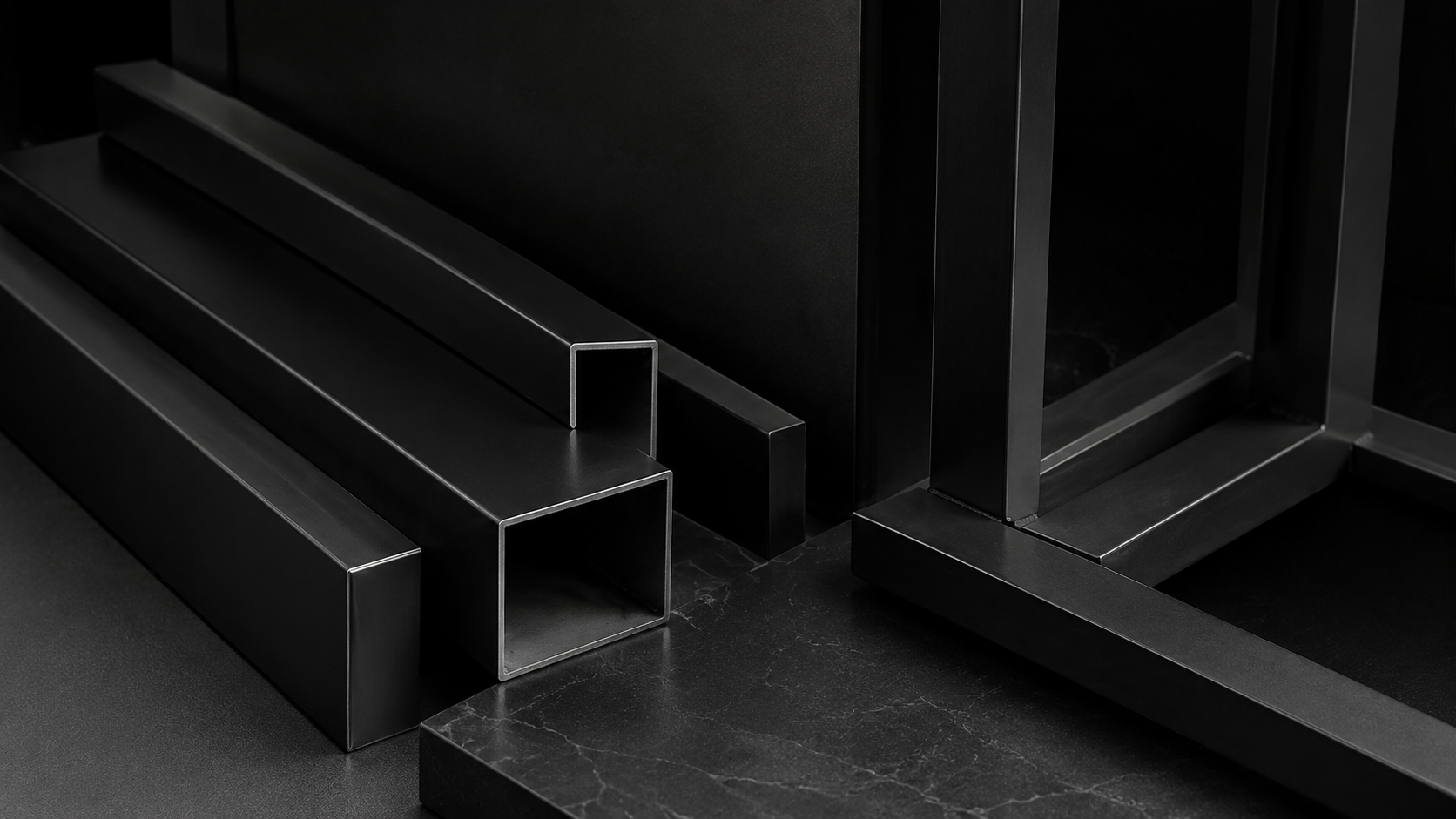 Matte black architectural steel profiles and precision-fabricated frame sections
