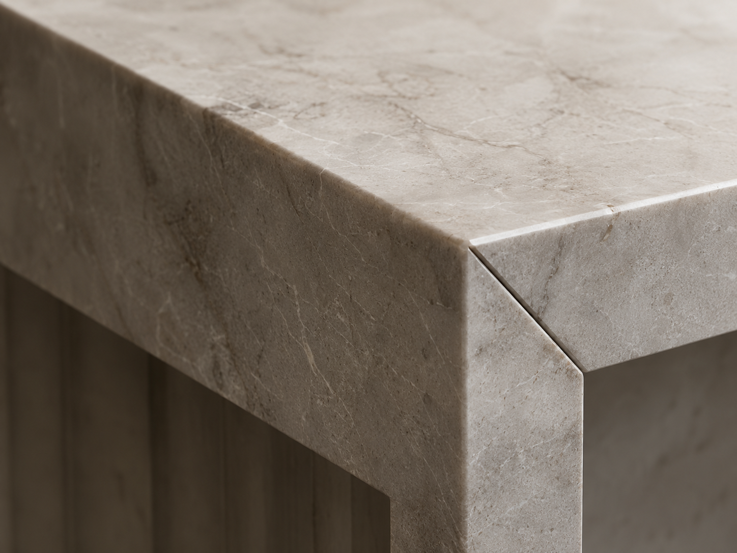 Seamless mitred edge on an ivory stone surface