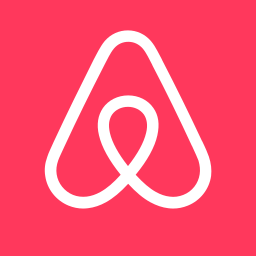 Airbnb logo on a pink background