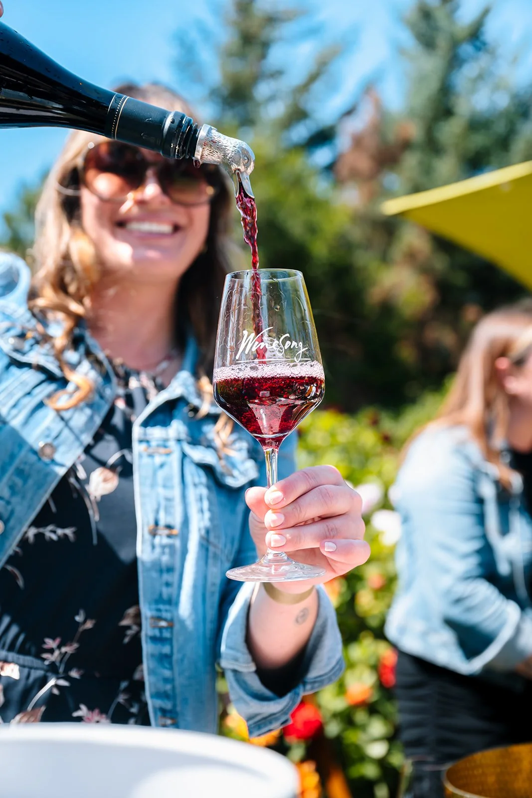 Winesong 2026 Wine Festival in Fort Bragg California Wine glass being poured into glass
