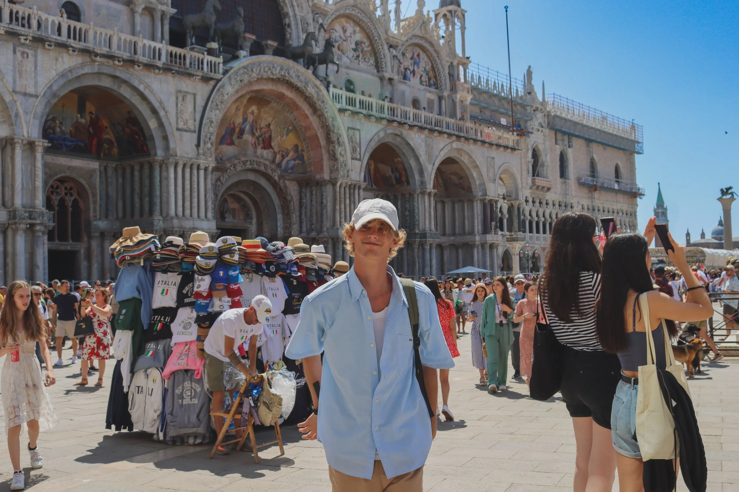 Crowd of tourists in Piazza San Marco with historical architecture and details in Venice, Italy.