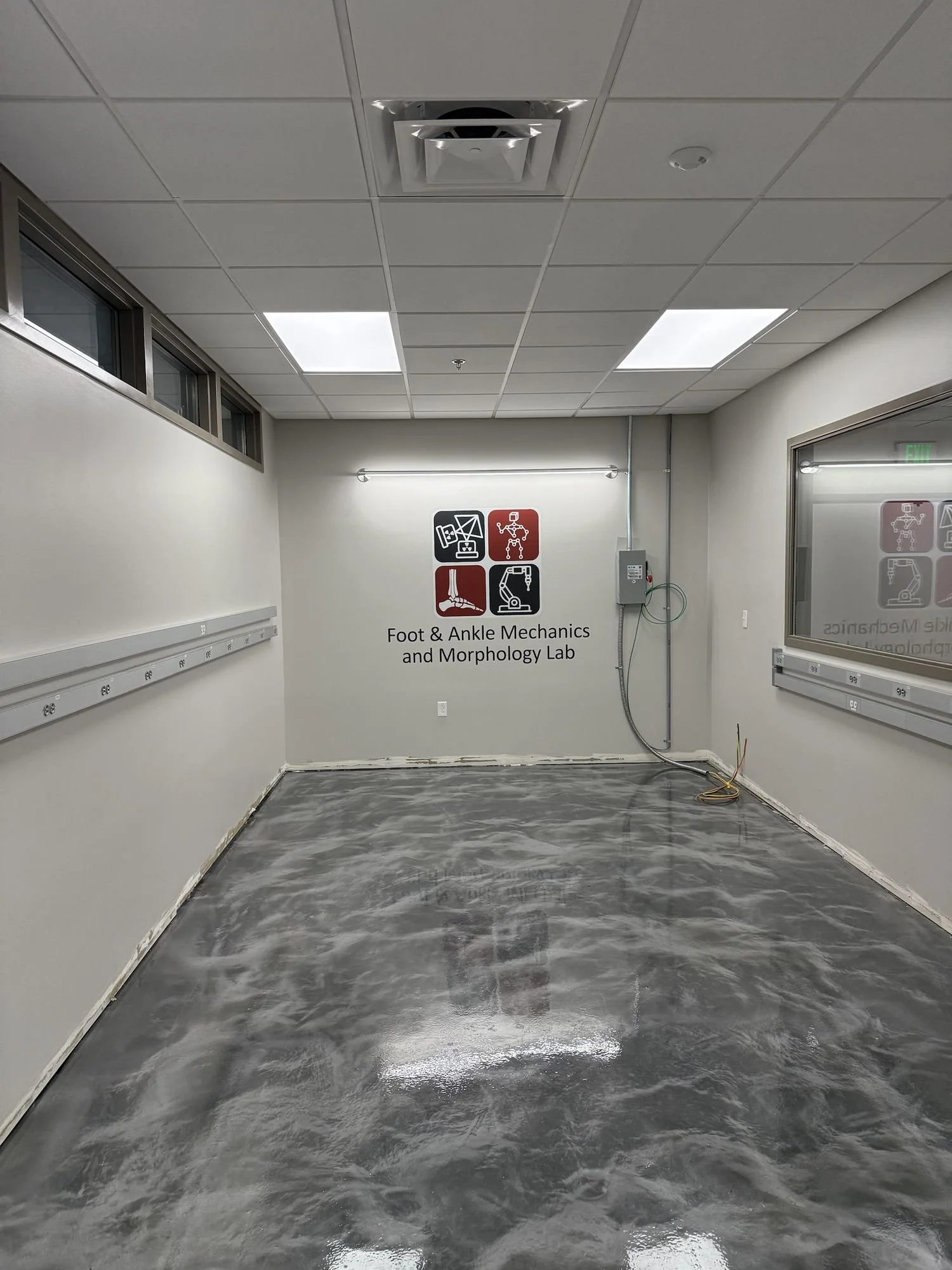 Foot and Ankle Mechanics and Morphology Lab logo printed on a wall at the University of Utah
