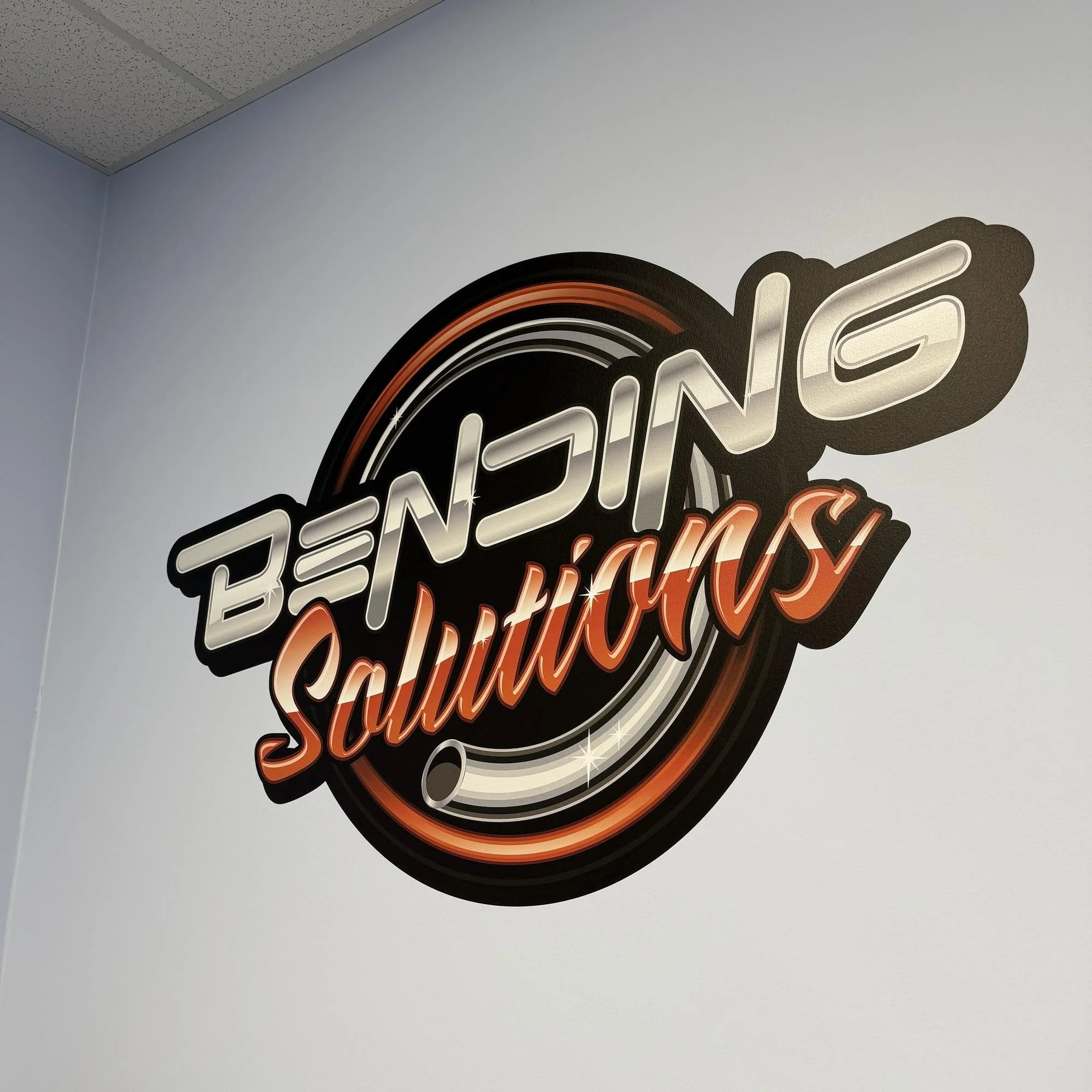 Bending Solutions logo printed directly onto an office wall in Salt Lake City