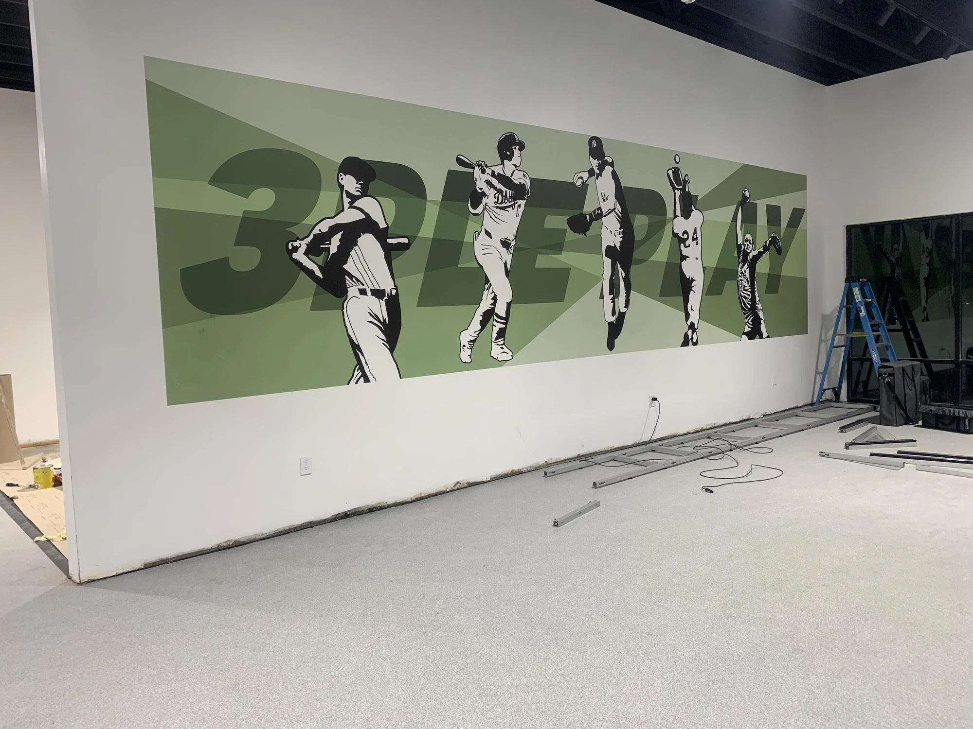 Large baseball player mural printed on the wall at Triple Play in Pleasant Grove, Utah