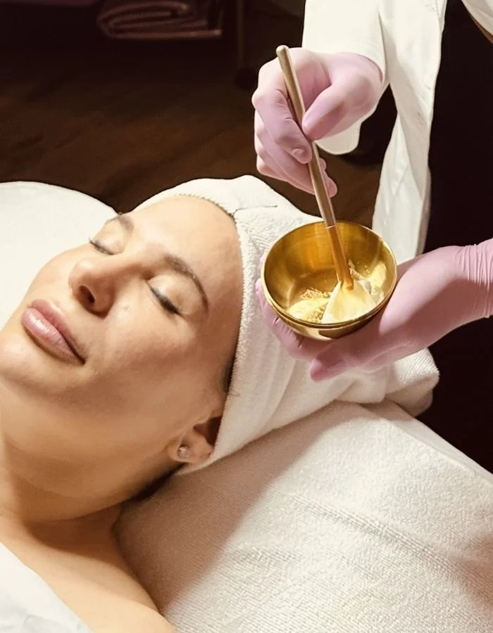 Female client receives chemical peel treatment during a Transformation facial in McKinney at Avila Skin Studio