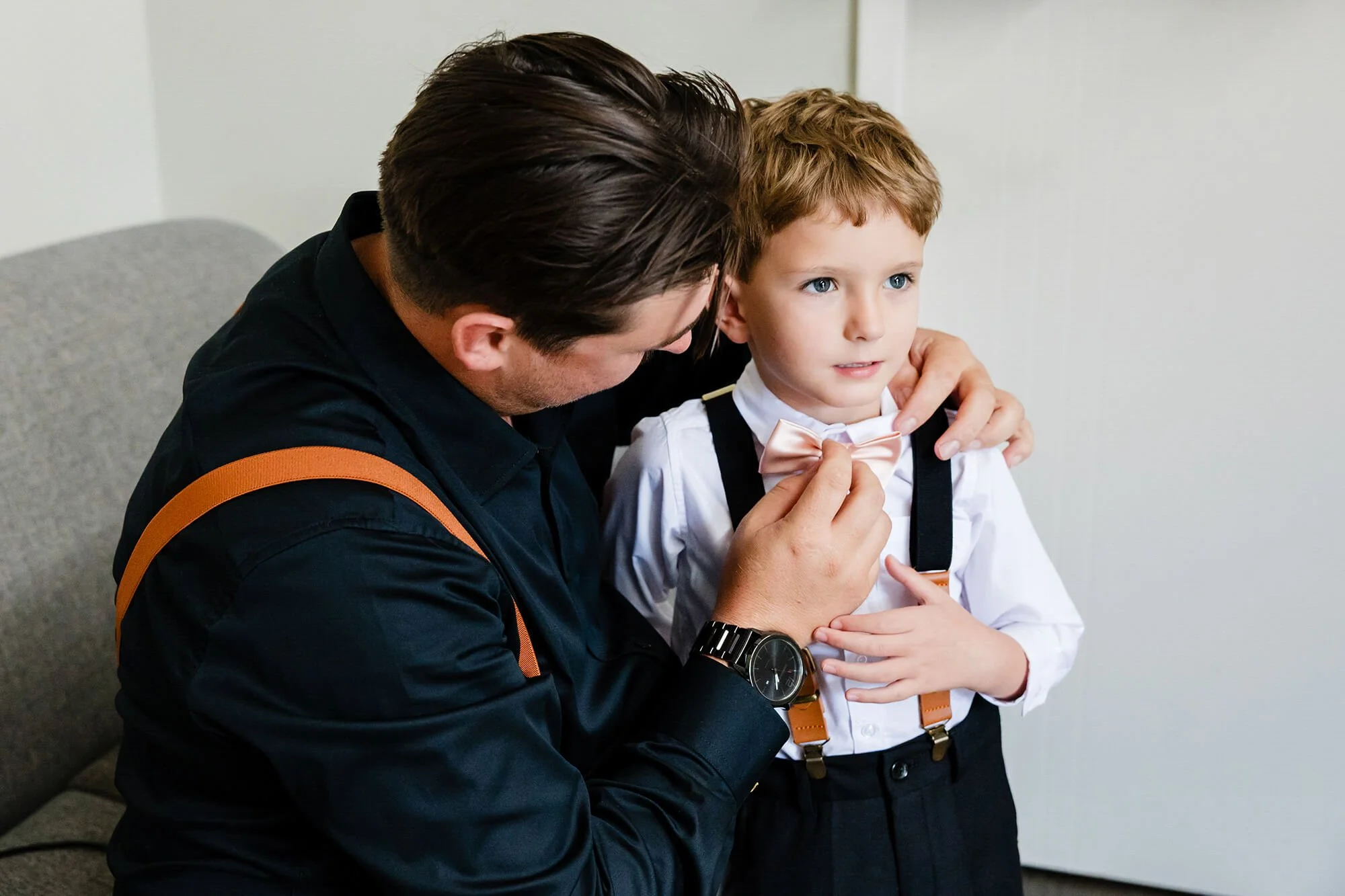 best-wedding-photography-groom-helping-boy-getting-dress.jpg
