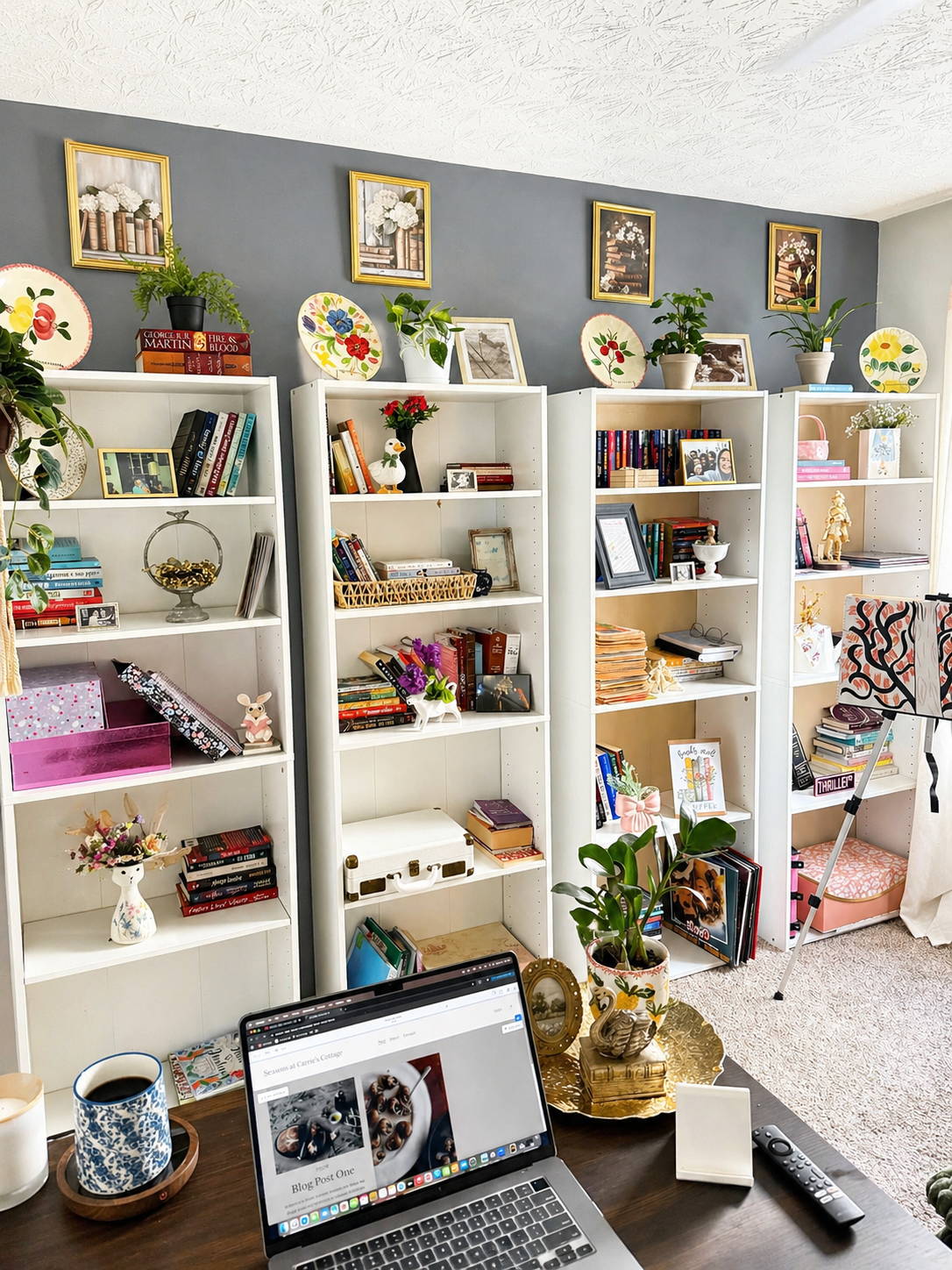 Cozy cottage home library with white bookshelves, vintage decor, plants, and a warm, peaceful reading space