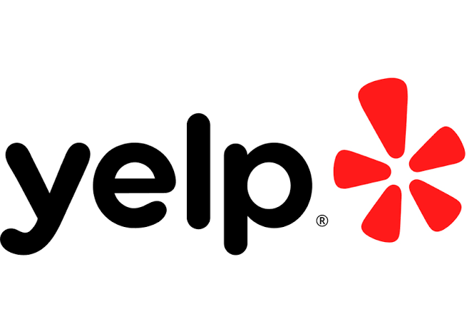 Logotipo de Yelp con letras negras y un símbolo rojo con forma de asterisco.