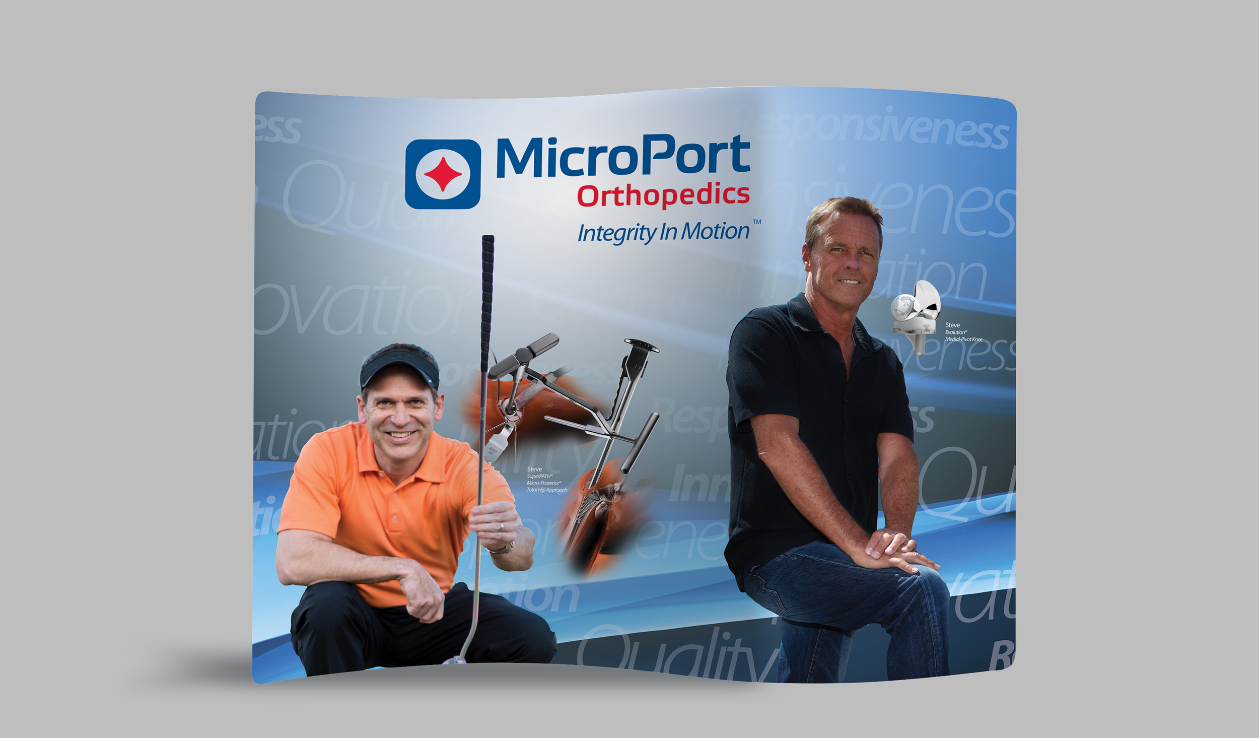 A promotional display for MicroPort Orthopedics featuring two men, one holding a medical device and the other sitting beside a knee joint model, with a backdrop displaying the company's logo and tagline.