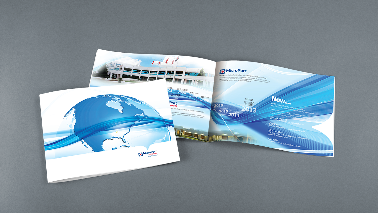 Open brochure with a blue globe illustration on the cover and a second page showing a building with flags and a timeline from 2003 to 2013.