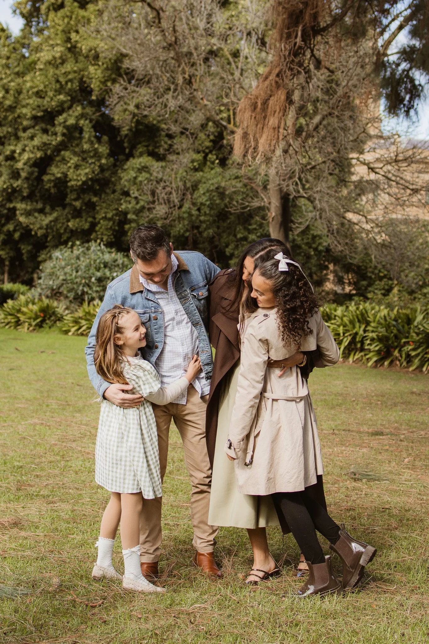 Family of four enjoying a relaxed outdoor photography session in Werribee
