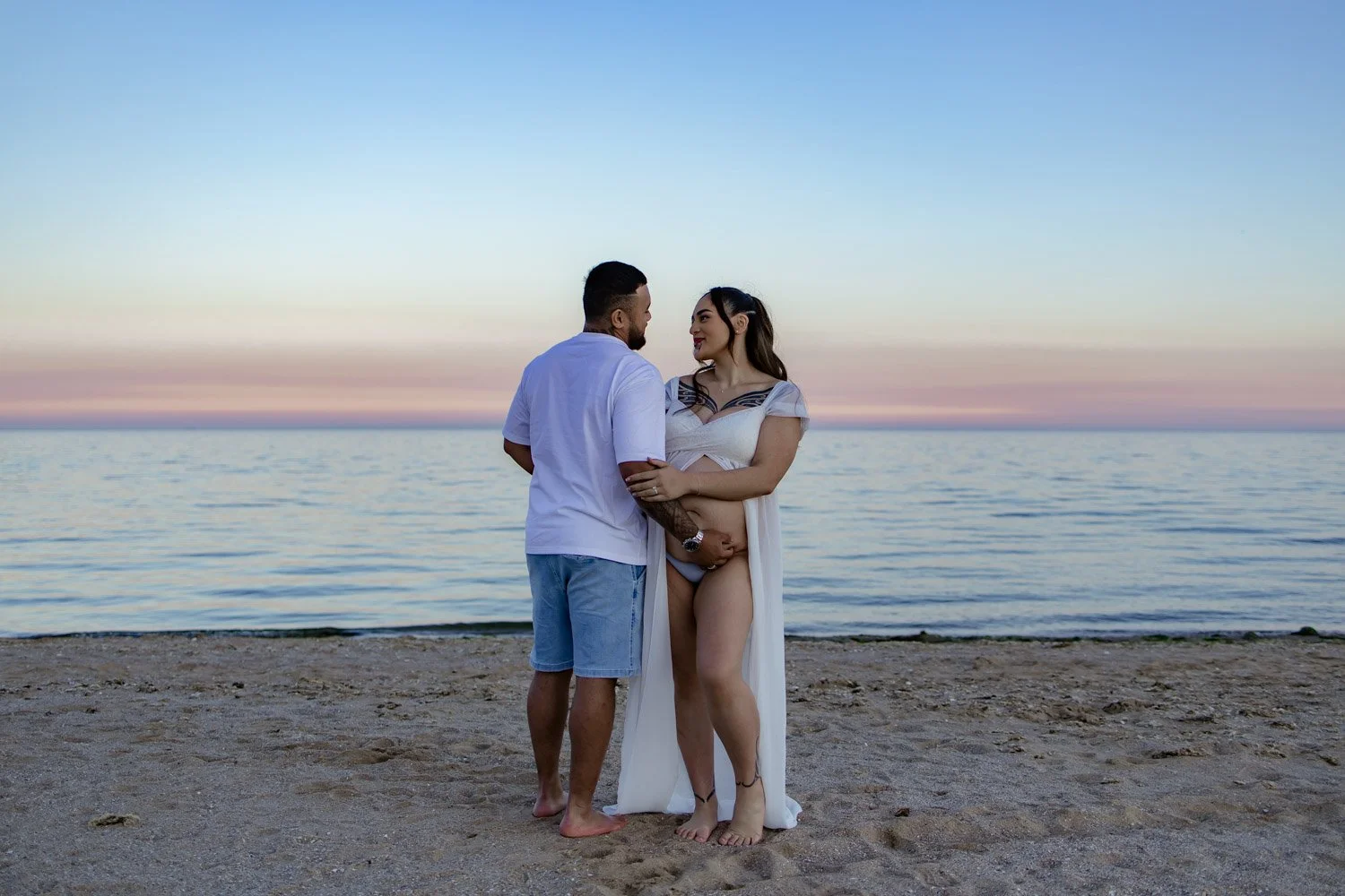 Pregnant couple enjoying a relaxed maternity photoshoot in Melbourne