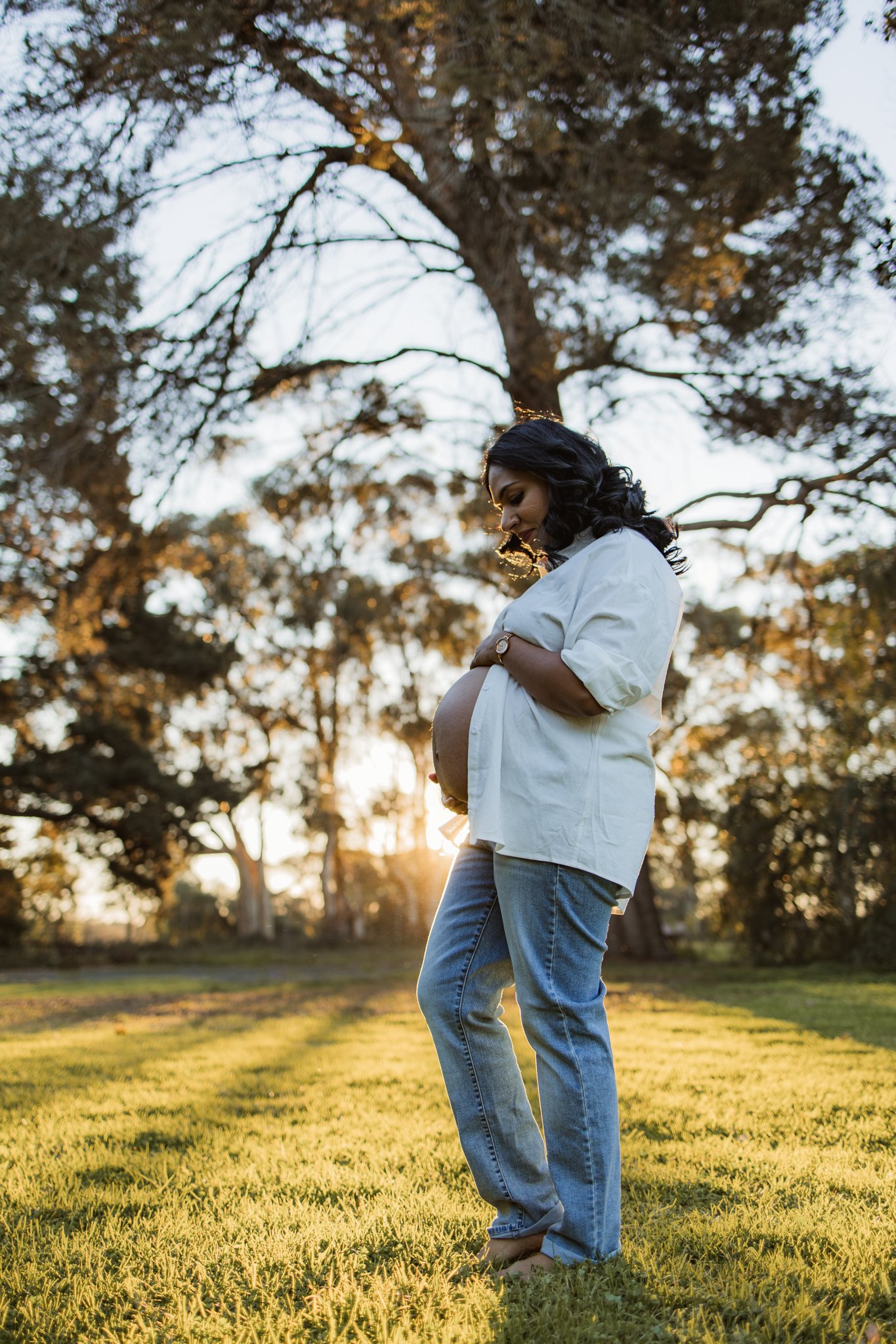 Mum holding her pregnant belly at her maternity photoshoot in Werribee, Melbourne's West