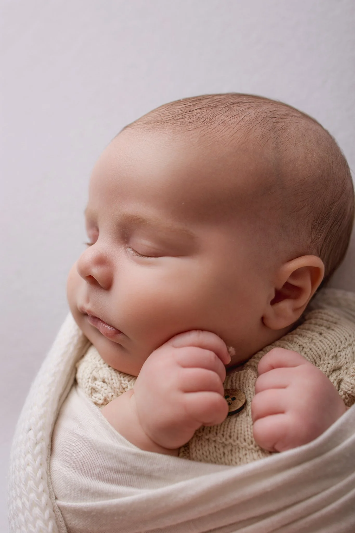 Fresh 48 photoshoot baby wrapped in a swaddle in Melbourne