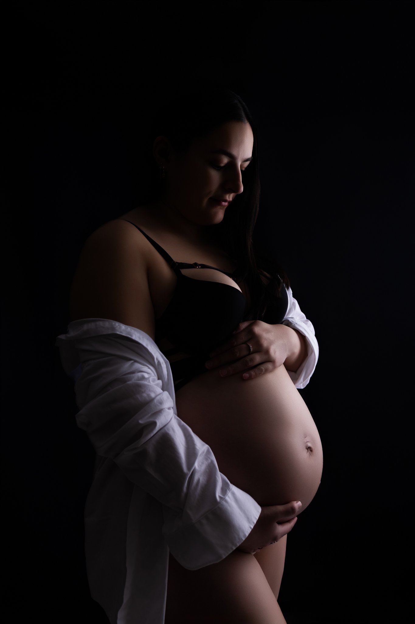 Studio Maternity Session in Melton West, Mum holding her growing bump