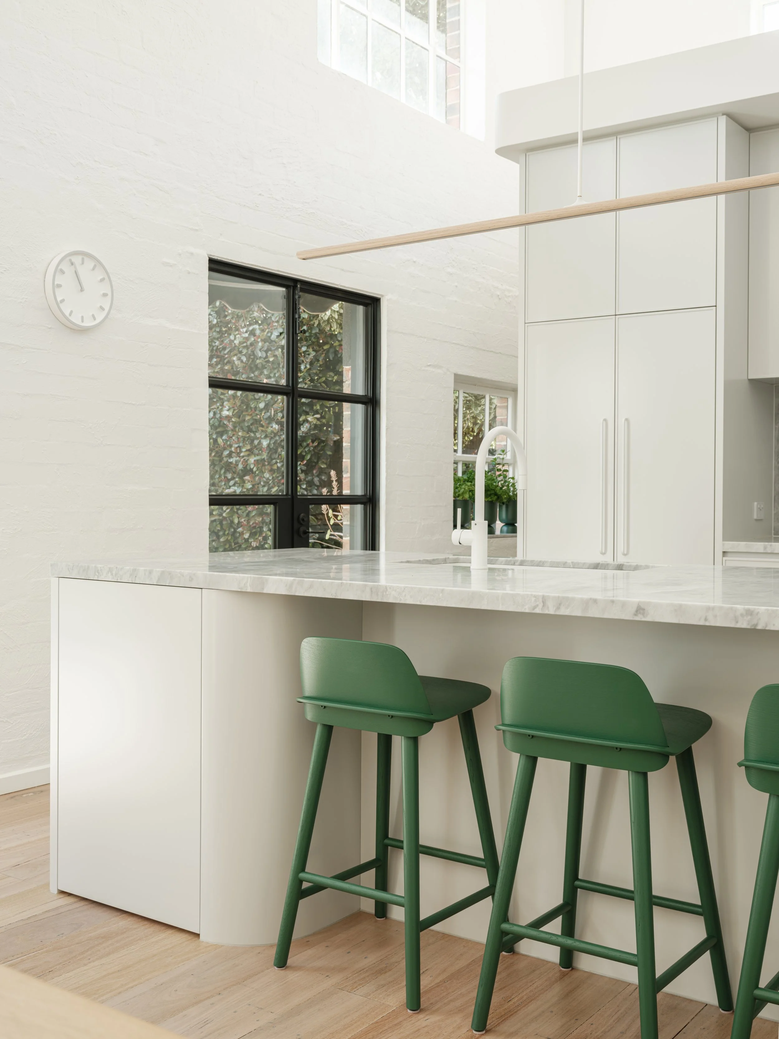 Stinton Project — modern kitchen with marble kitchen island, green bar stools and white cabinetry, Kingston Built, Geelong