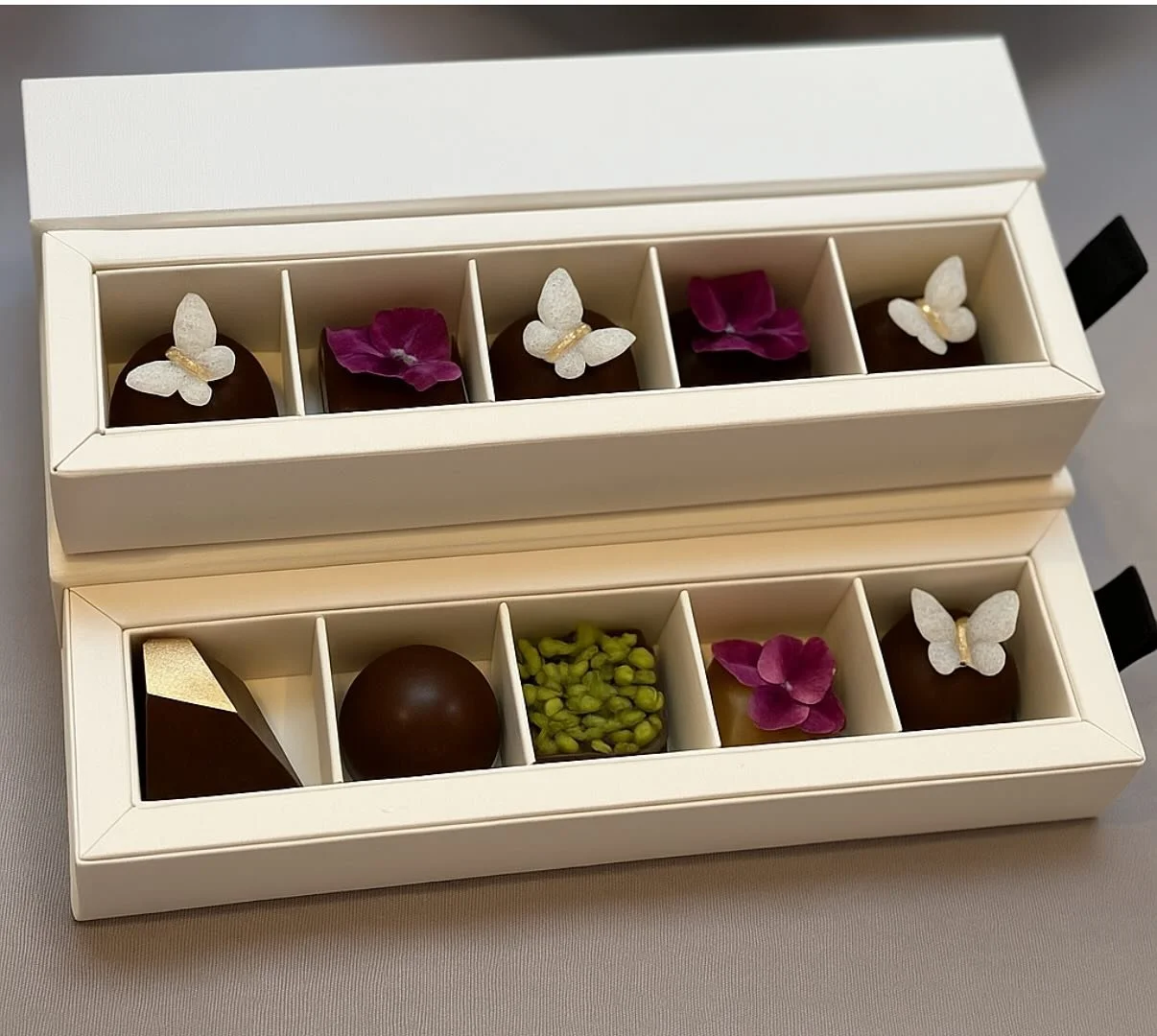 Each of these truffles is a story&mdash;crafted with intention, beauty, and heart. 💝
@rairechocolate was born from a moment of compassion: a handmade truffle recipe created to comfort a friend battling cancer. Now, each piece honors joy, connection,