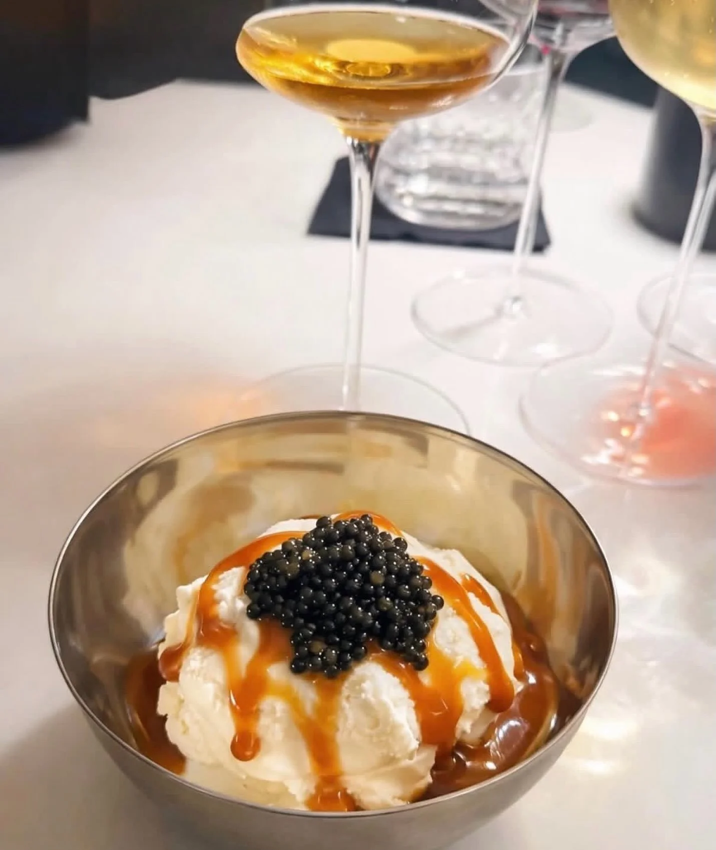 Still dreaming about this dessert at @we.are.darkroom &mdash; cr&egrave;me fra&icirc;che freddo, salted honey banana, dry-aged beef caramel, and a crown of caviar.