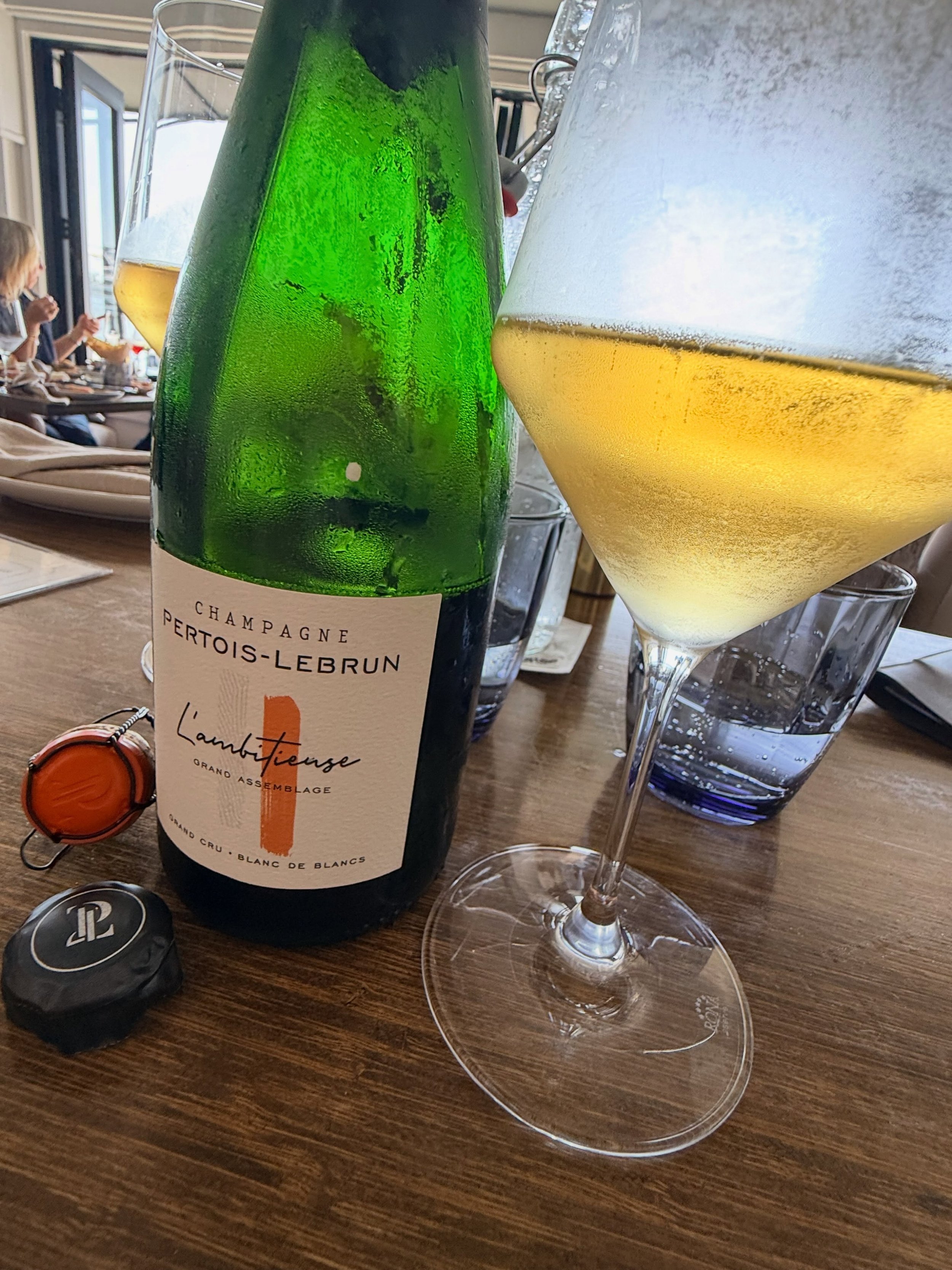 @champagnepertoislebrun.
 Champagne: Pertois-Lebrun L&rsquo;Ambitieuse Grand Assemblage
Release: 2018 + R&eacute;serve Perp&eacute;tuelle
Style: Grand Cru Blanc de Blancs, Extra Brut
Grape: 100% Chardonnay
Blend: 50% 2018 harvest + 50% perpetual rese