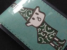 かわいい黒と白のシャツを着た猫のイラスト