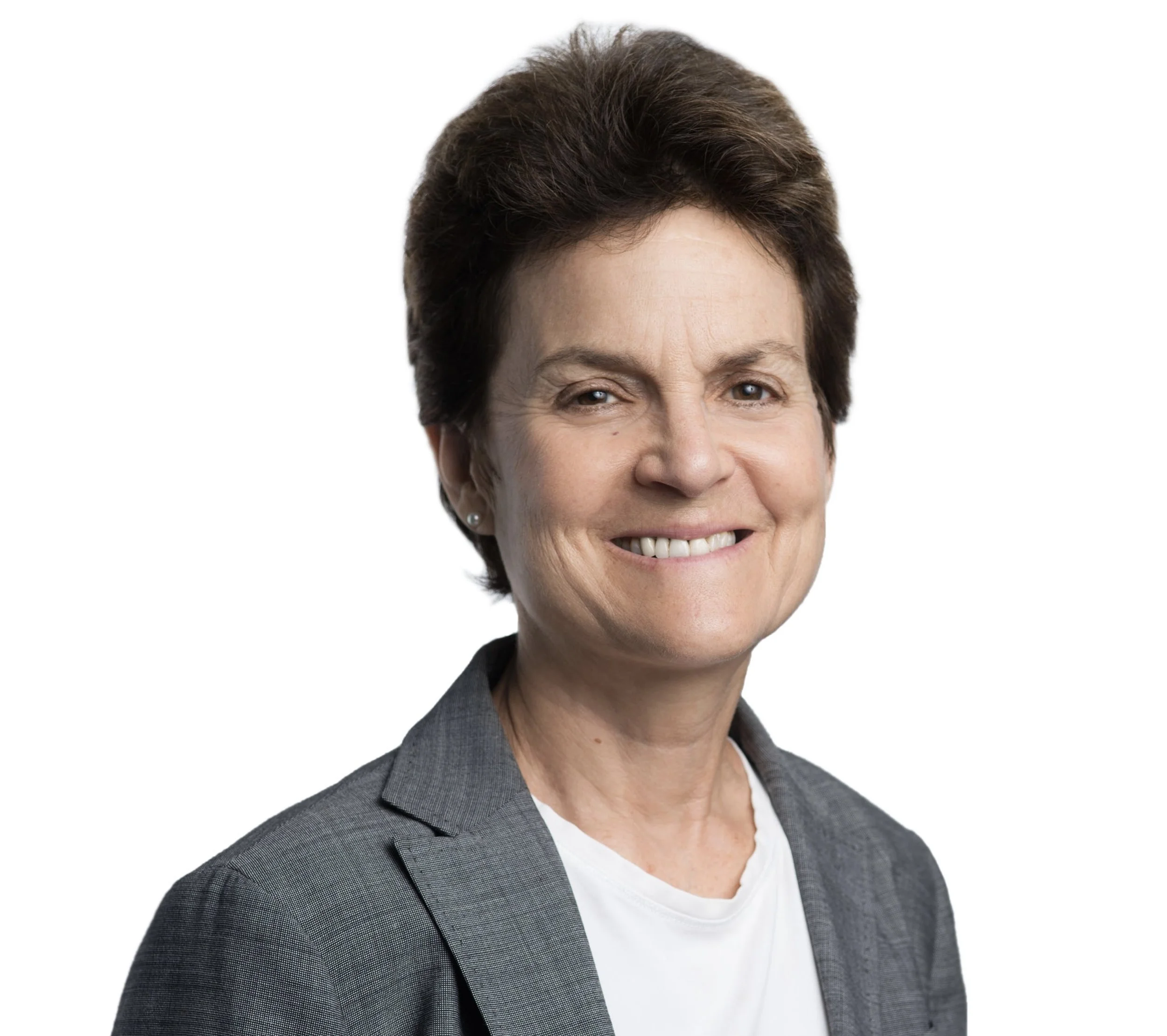 Close-up of a middle-aged woman with short brown hair, smiling, wearing a gray blazer and white top, against a white background.