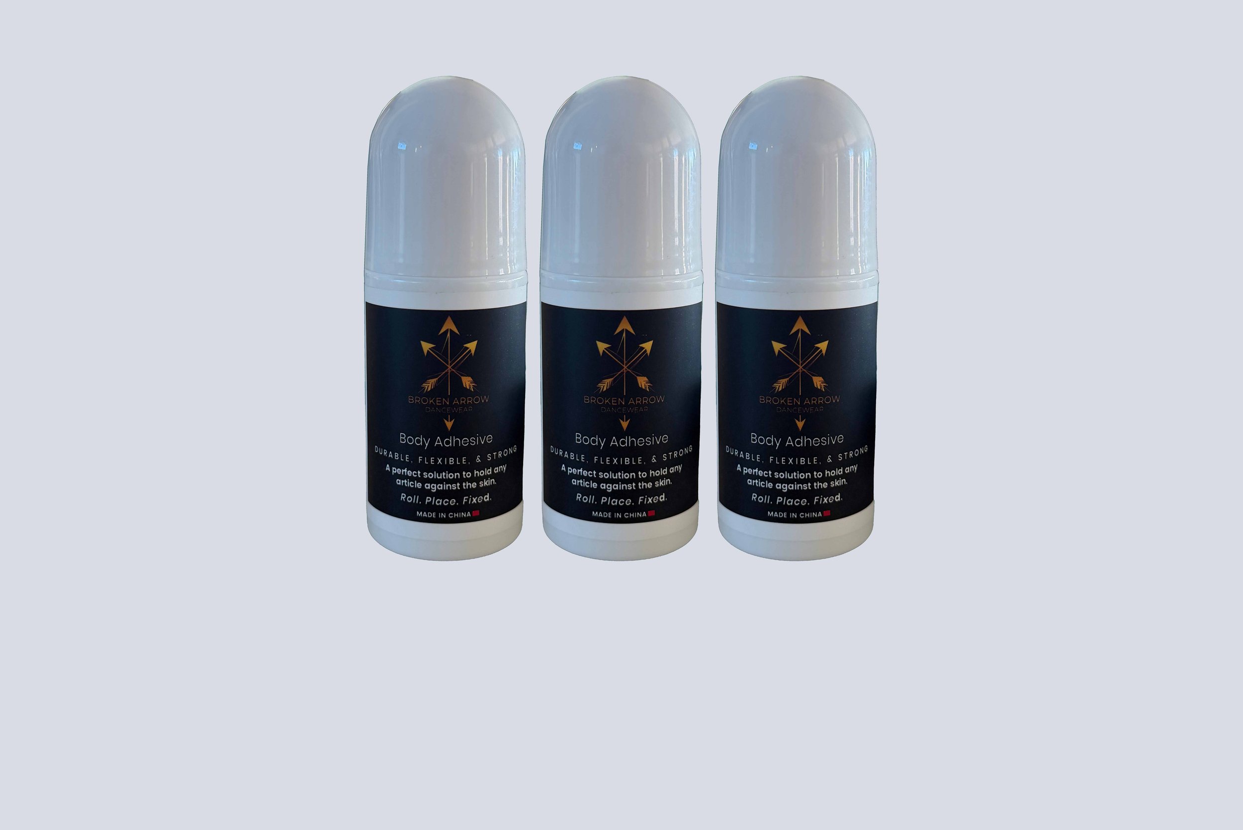 Three bottles of Broken Arrow Dancewear body adhesive.