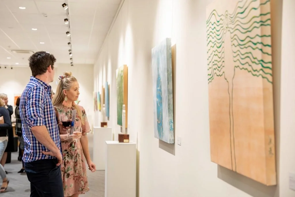 People viewing artwork in an art gallery