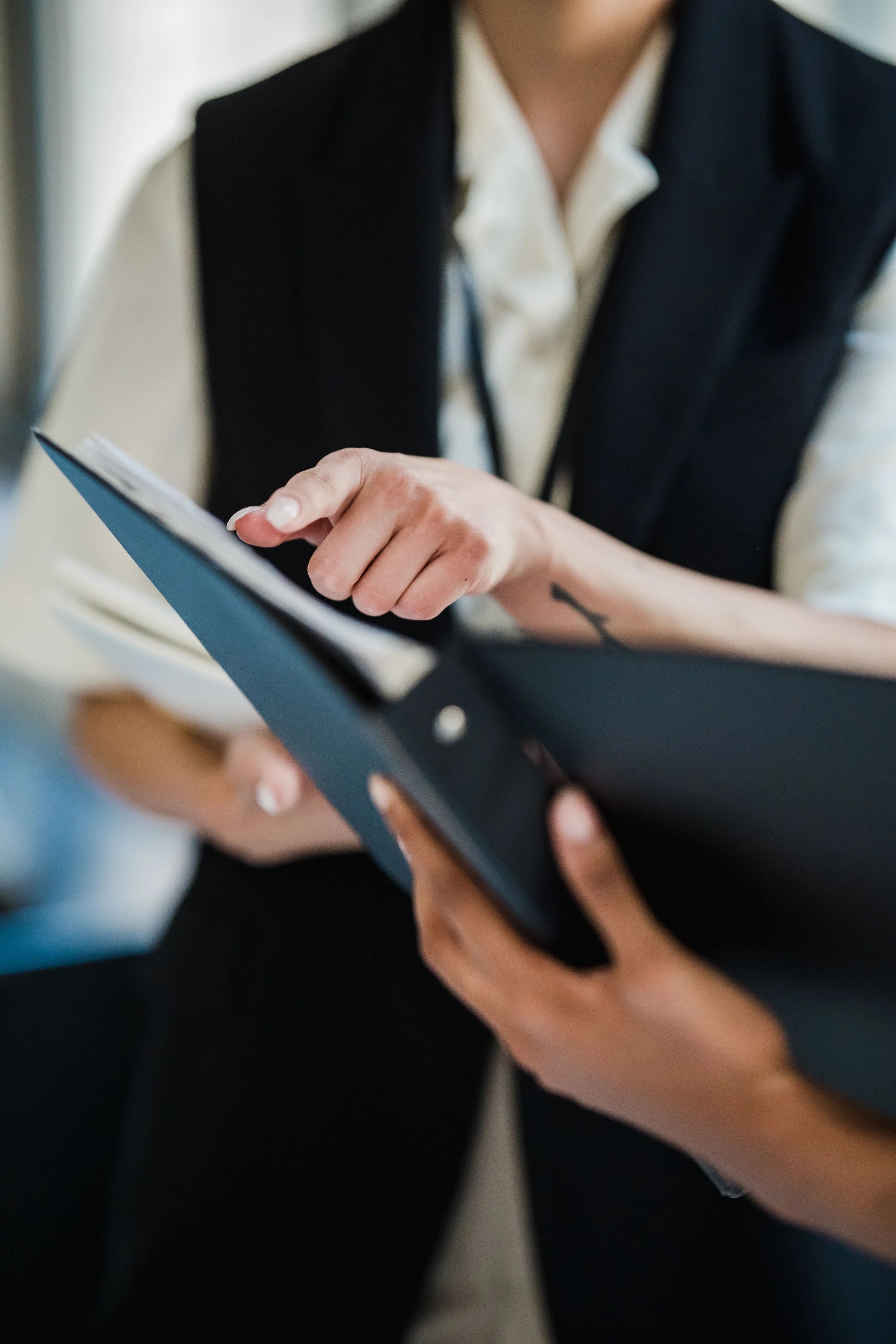 Two professionals reviewing project information on a tablet