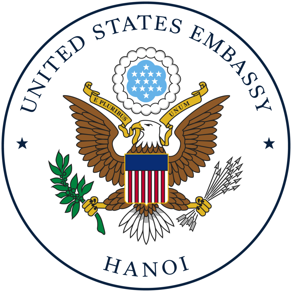 Seal of the United States Embassy in Hanoi, featuring an eagle, shield, olive branch, arrows, and the words 'United States Embassy Hanoi'
