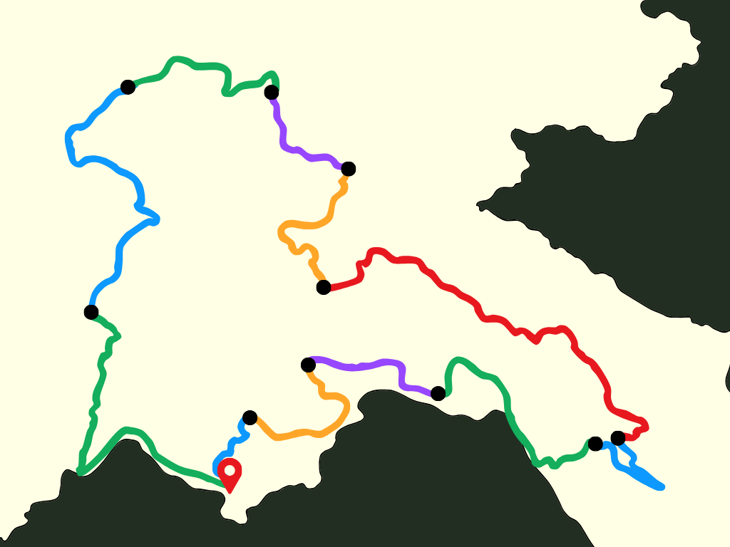 Carte approximative du Laos avec différentes lignes de transport colorées reliant plusieurs points et une icône de localisation rouge en bas à gauche.