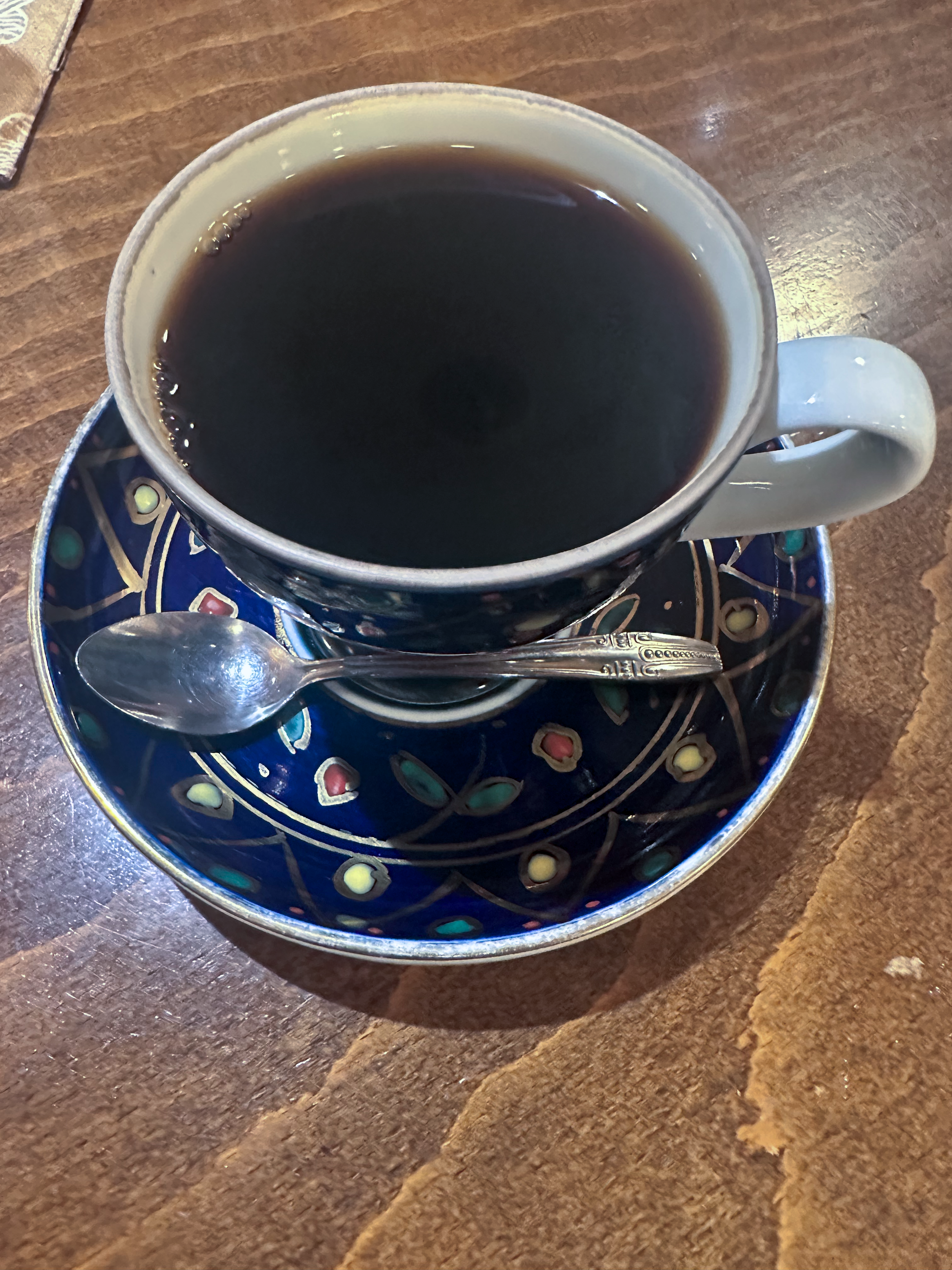 specialty coffee cups on a wooden table, representing the intimate, small-group pacing of a Tokyo Coffee Tours experience in Kita-Senju.