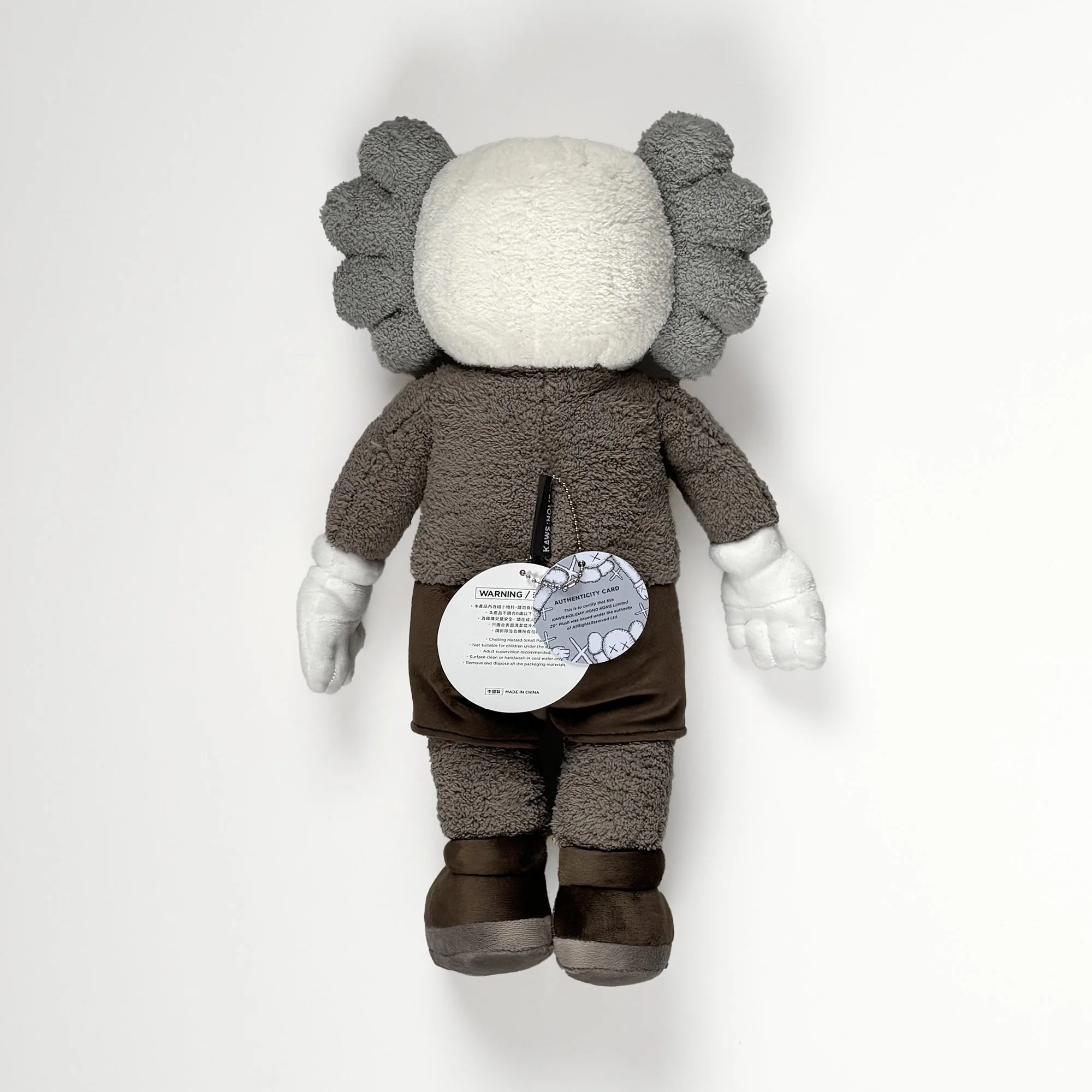 KAWS Hong Kong Holiday Plush, 2019, brown, back view