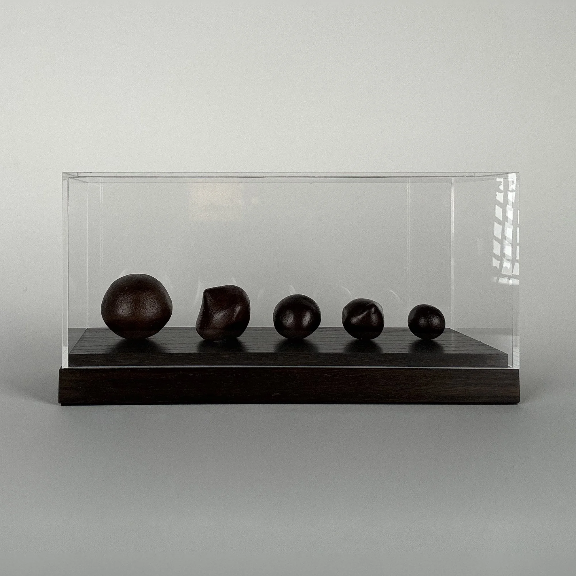 Antony Gormley Handstones, 2019, bronze sculpture in perspex display box
