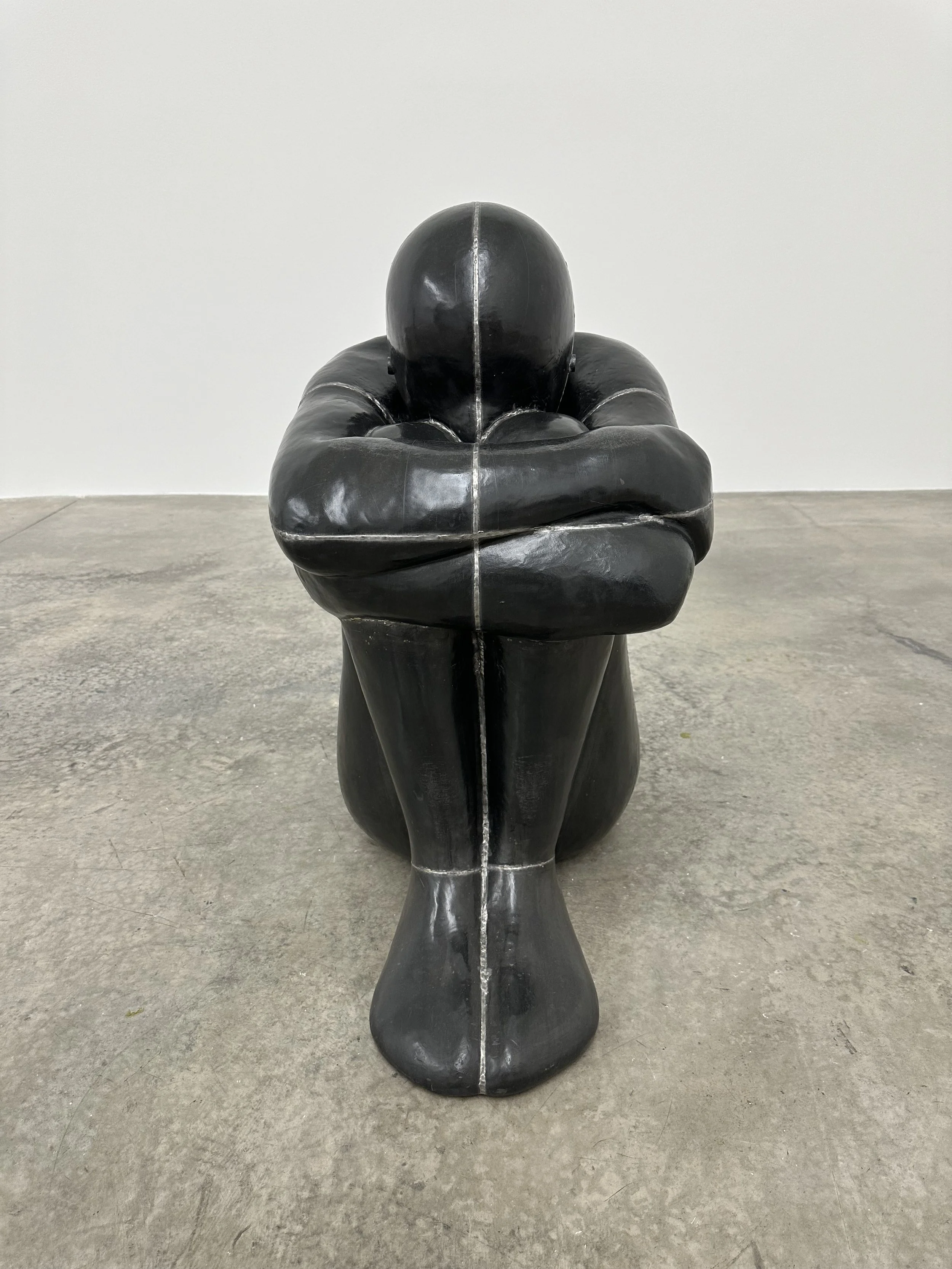 antony gormley  abstract human sculpture seated on the floor of the white cube gallery bermondsey london