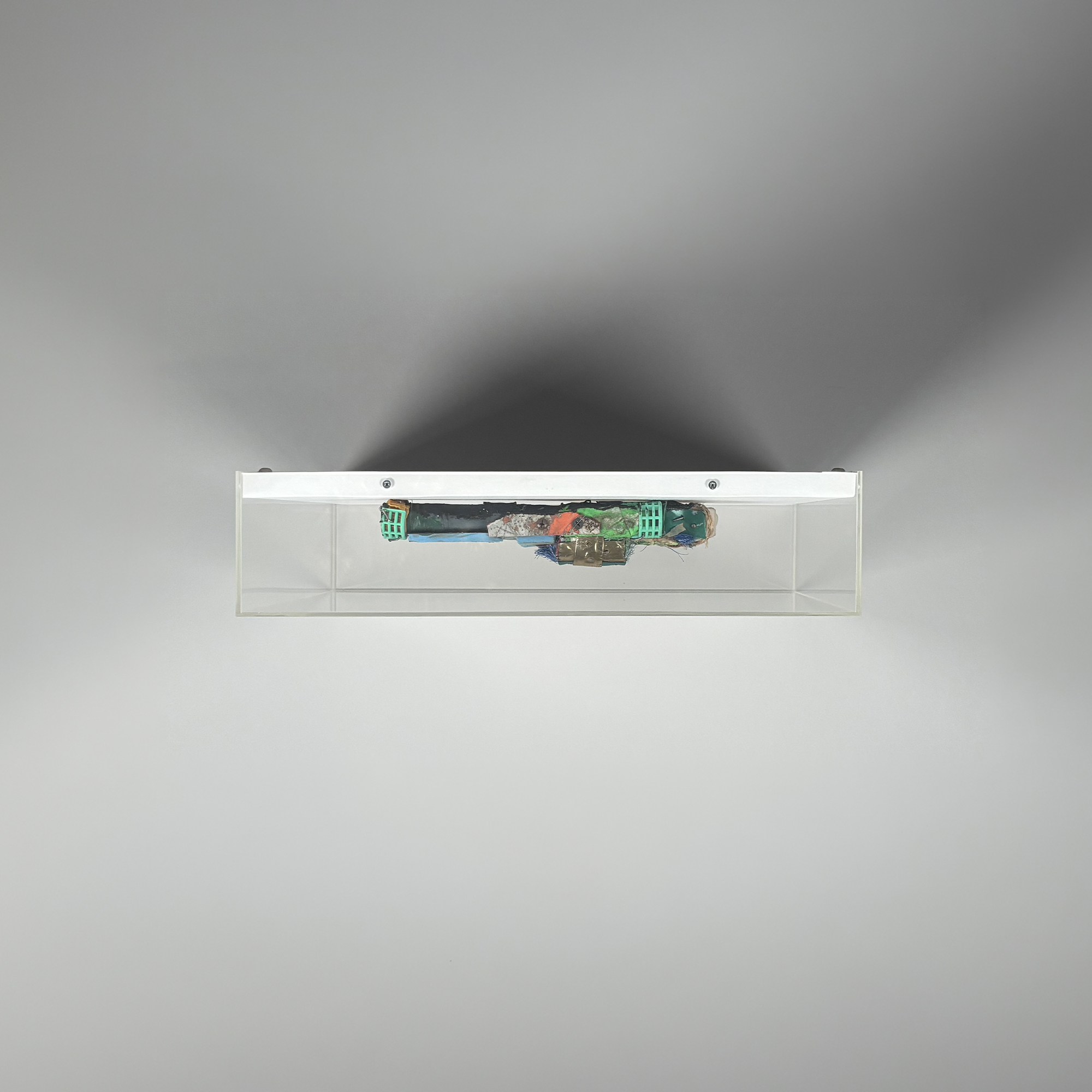 BAST Trash Gun I, 2014, unique mixed media sculpture in acrylic display box, top view