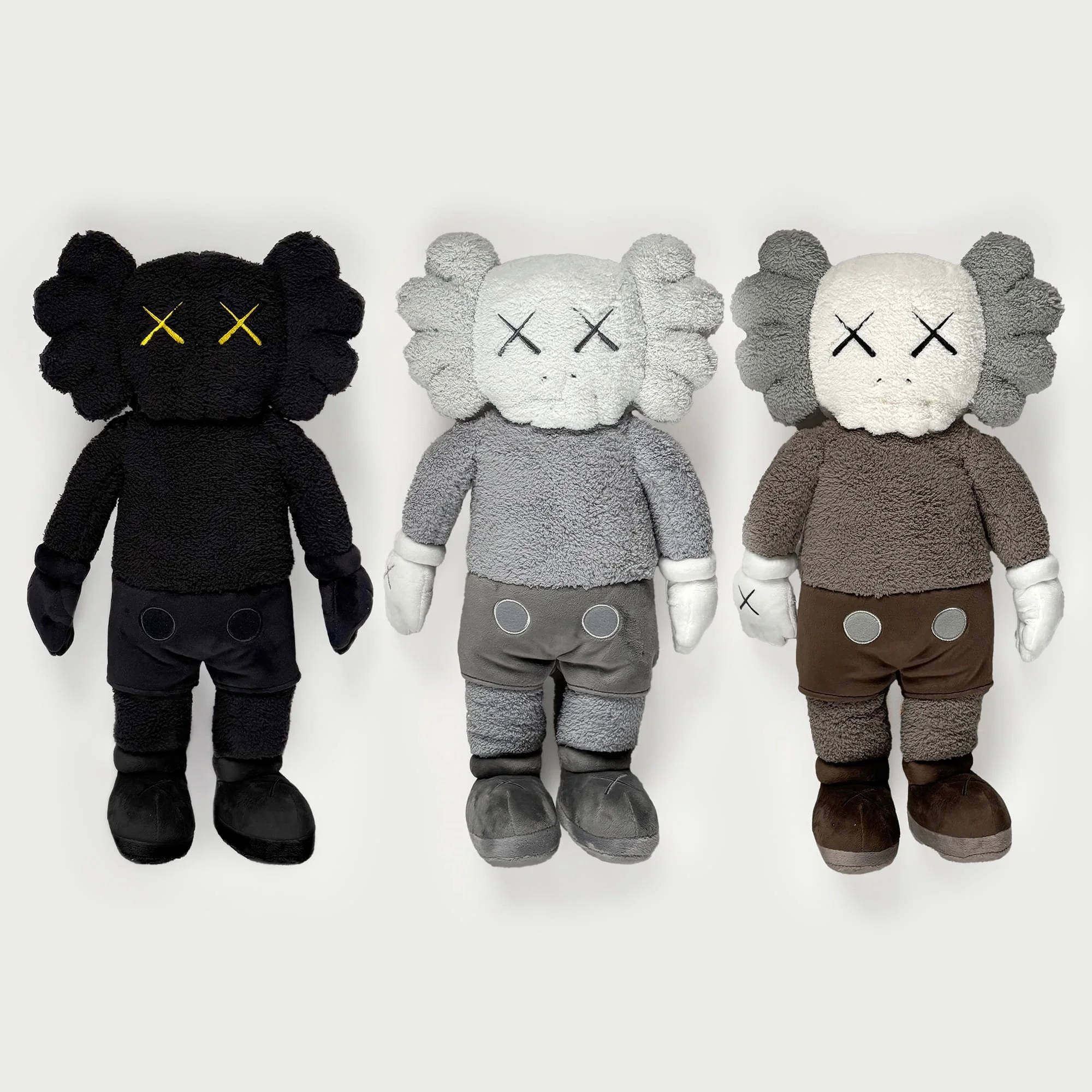 kaws hong kong holiday plush figures x 3.jpg